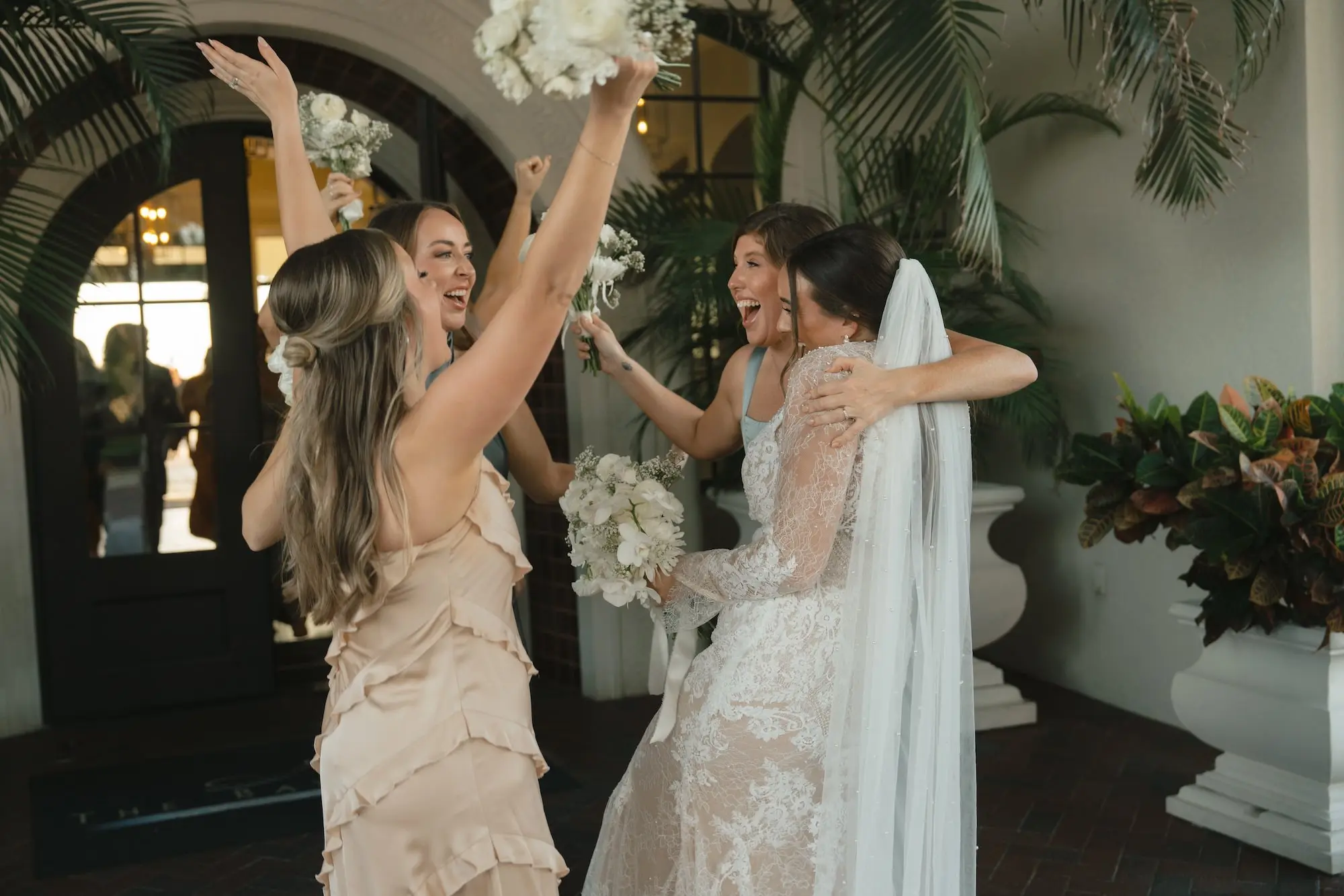Bride and Bridesmaids Celebrating Wedding Portrait