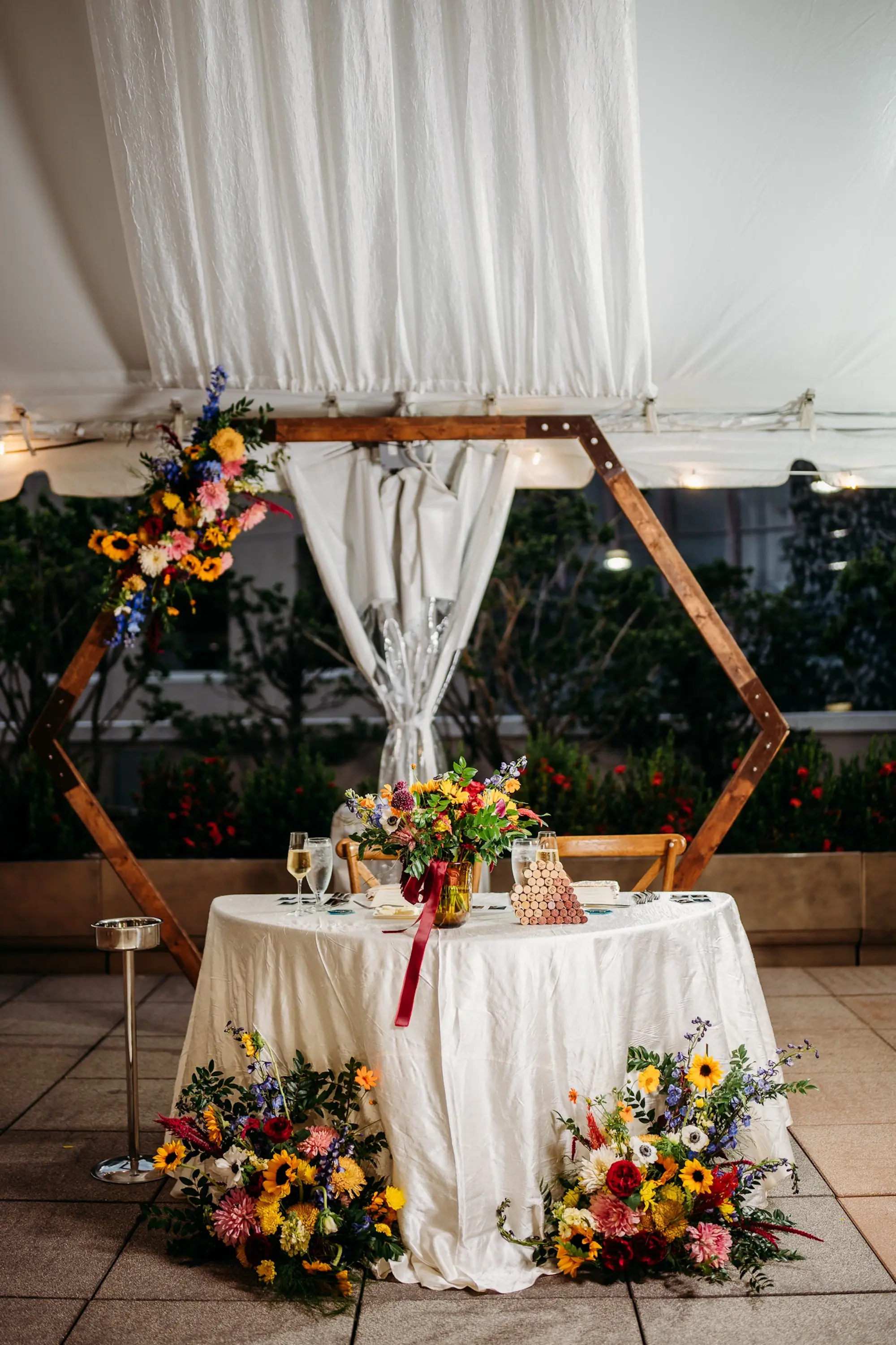 Colorful Flower Wedding Reception Sweetheart Table Decor Ideas | White, Red, Blue, and Yellow Floral Arrangement Inspiration