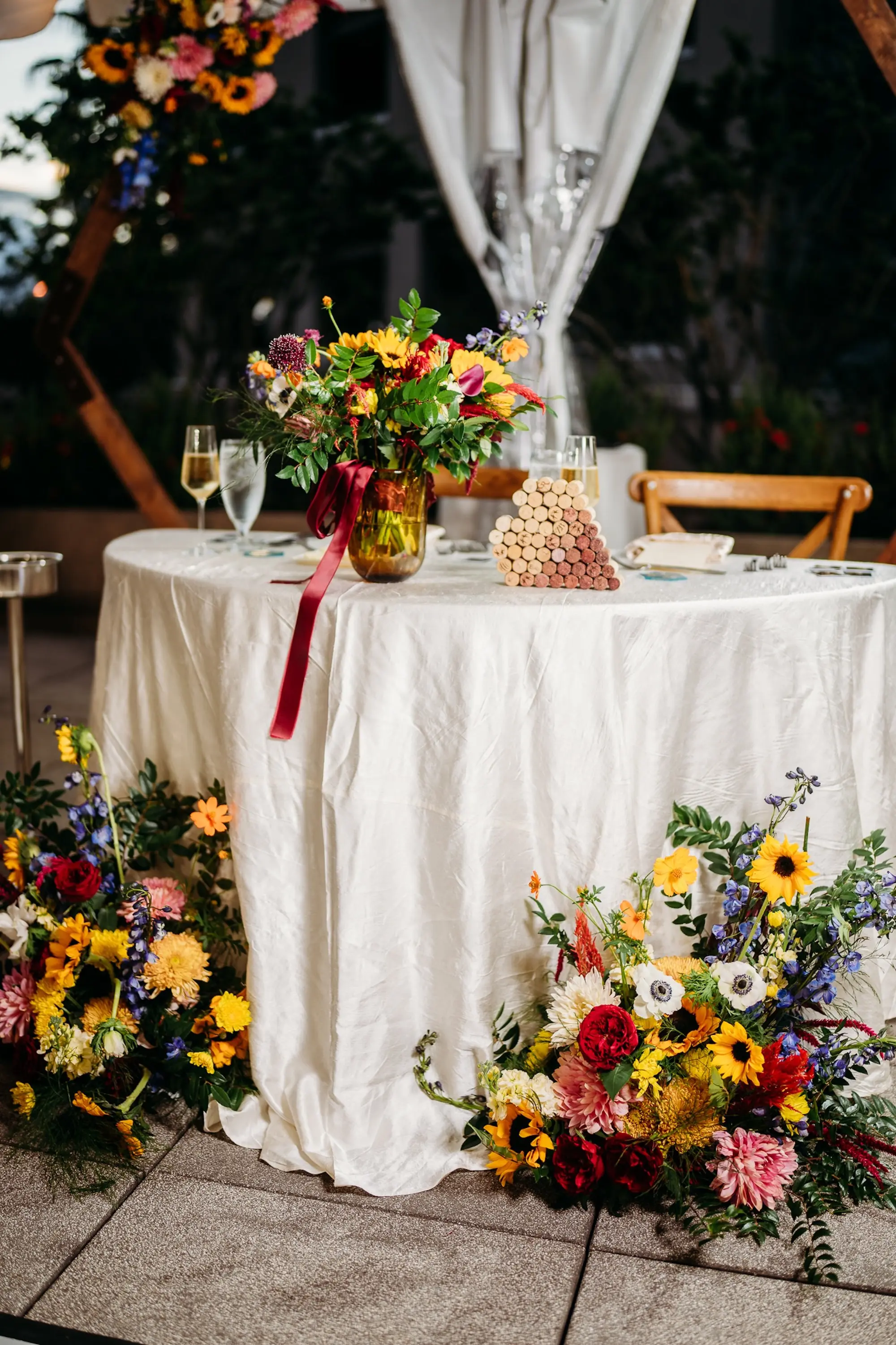 Colorful Flower Wedding Reception Sweetheart Table Decor Ideas | White, Red, Blue, and Yellow Floral Arrangement Inspiration