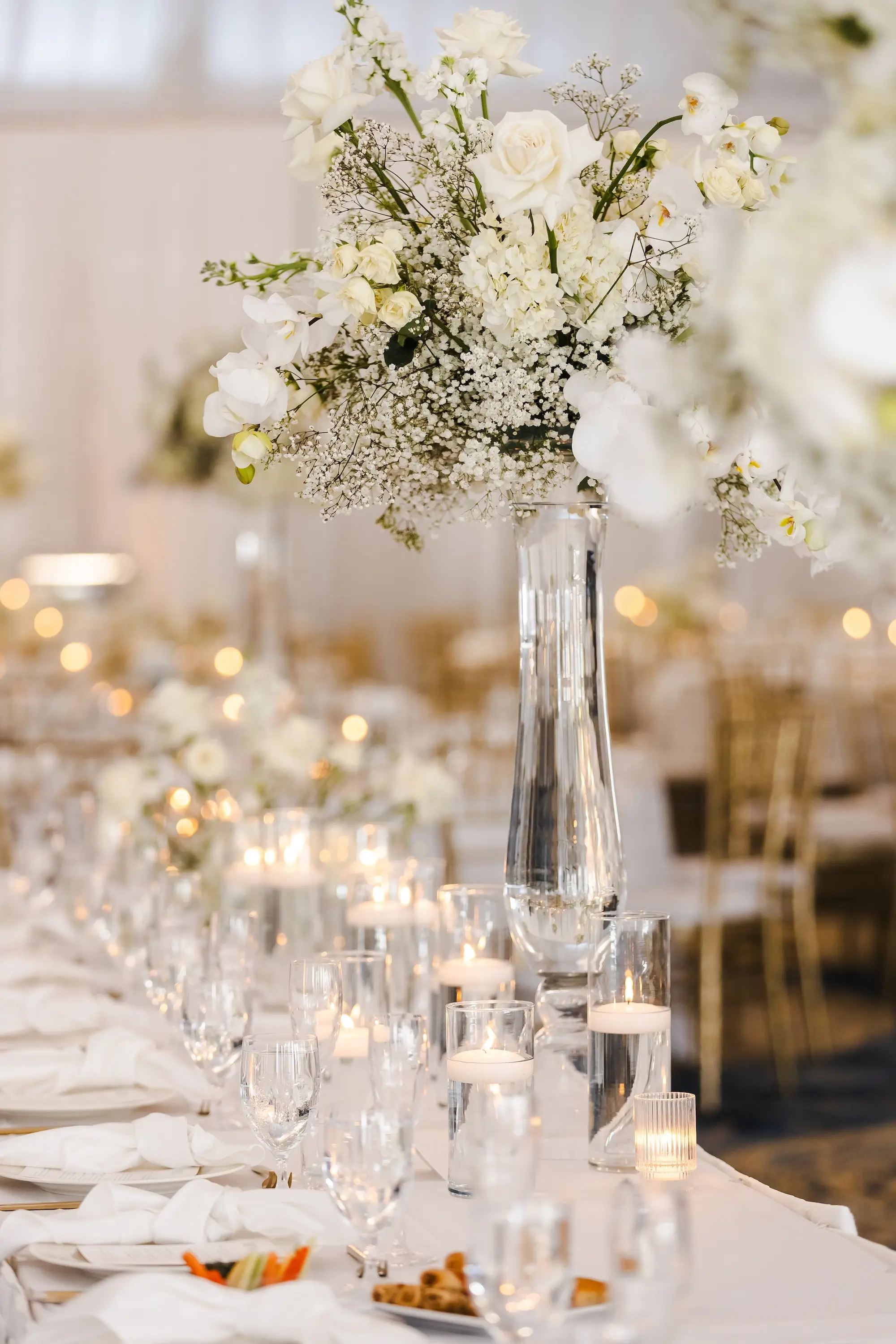 Classic Champagne and Black Florida Beach Tented Ballroom Wedding Reception | White Flower Roses and Baby's Breath in Tall Glass Vase Centerpiece Decor Ideas