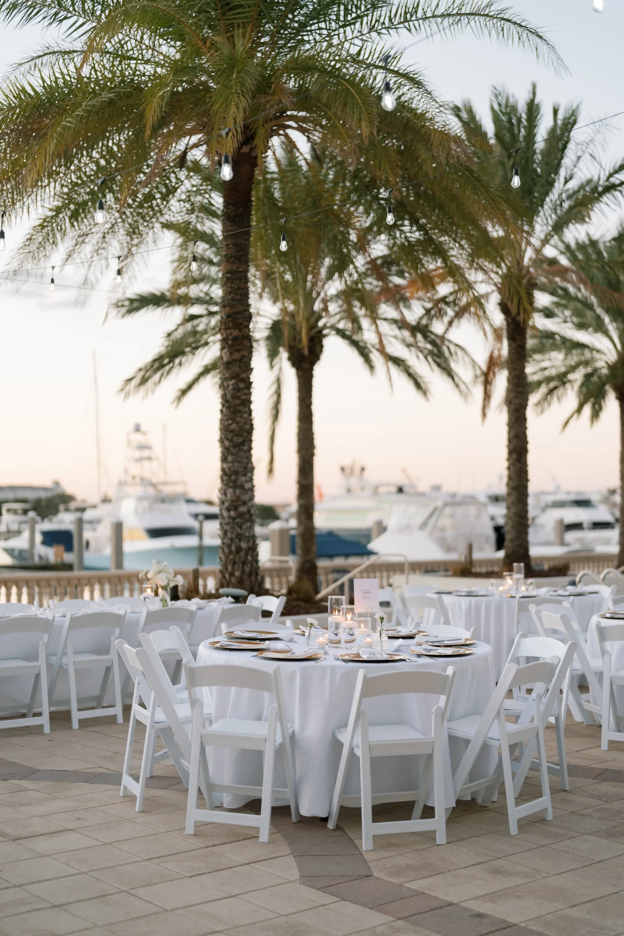 Romantic White and Gold Waterfront Wedding Reception Decor Inspiration | White Folding Garden Chairs | Tampa Bay Event Venue Westshore Yacht Club