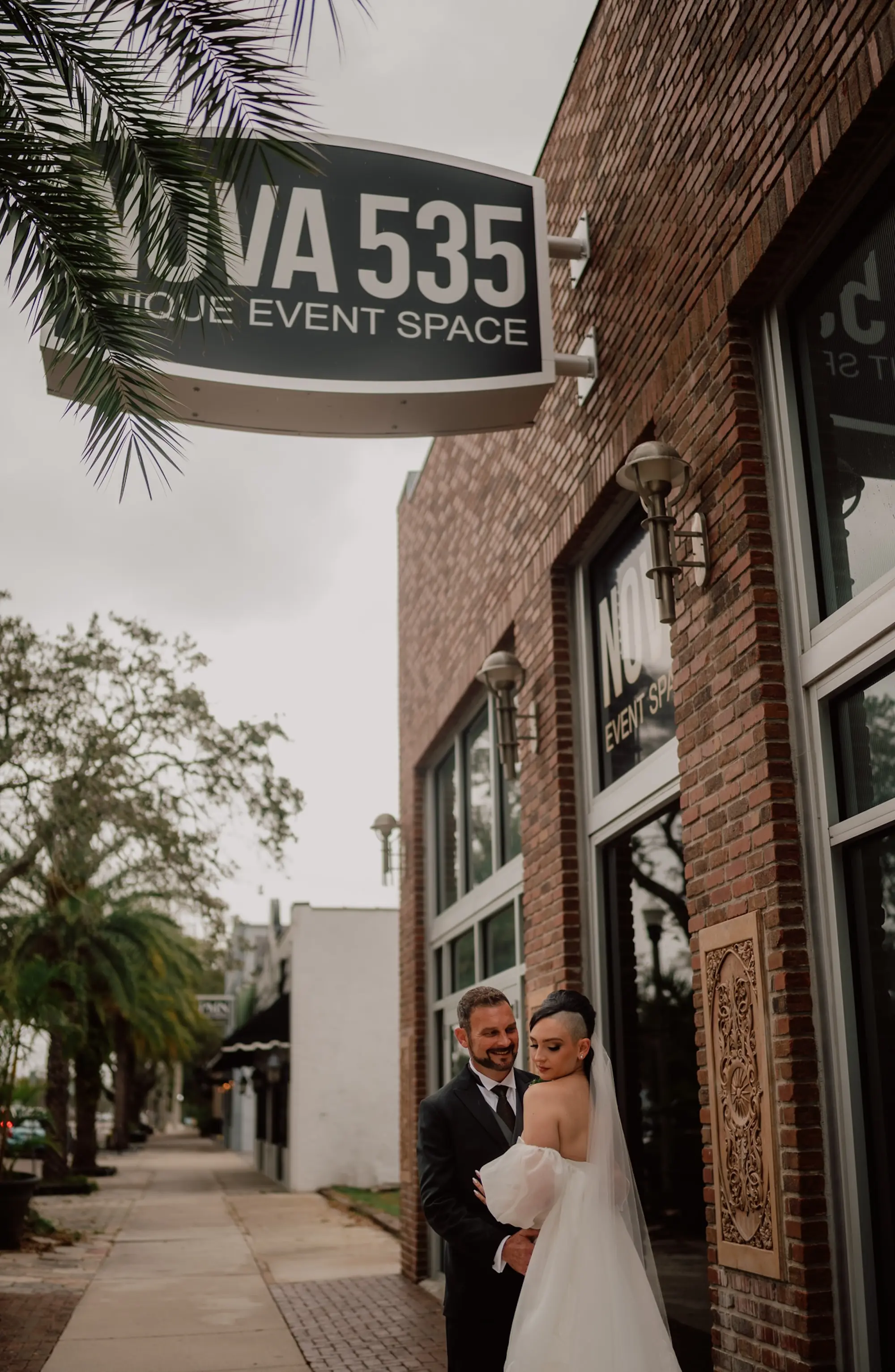 Bride and Groom in Front of Venue Wedding Portrait | Downtown St Pete Wedding Venue NOVA 535