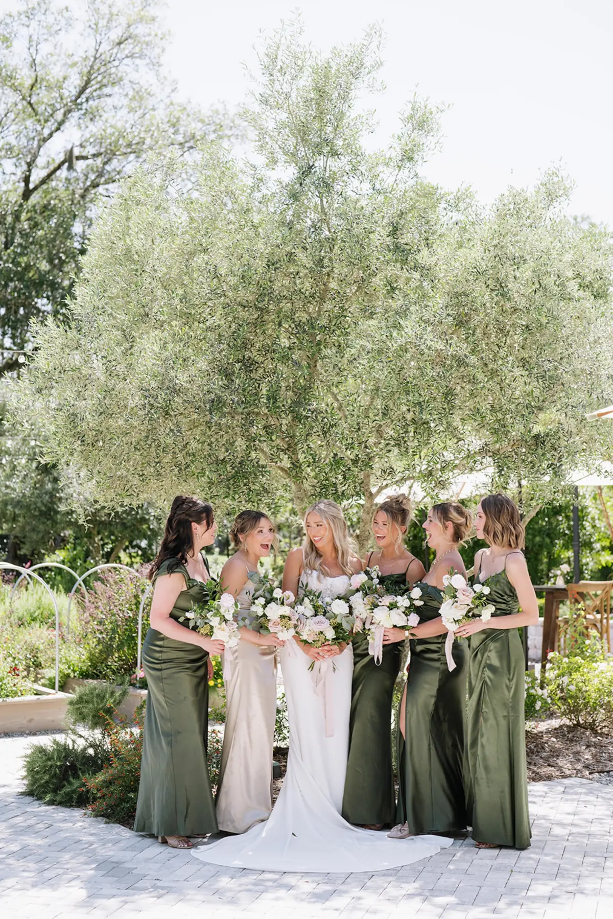 Bride and Bridesmaids Wedding Portrait | Mismatched Satin Olive Green and Light Champagne Bridesmaid Dresses Inspiration | Half Up Half Down Soft Curls Bridal Hair Inspiration | Tampa Bay Hair and Makeup Artist Femme Akoi Beauty Studio