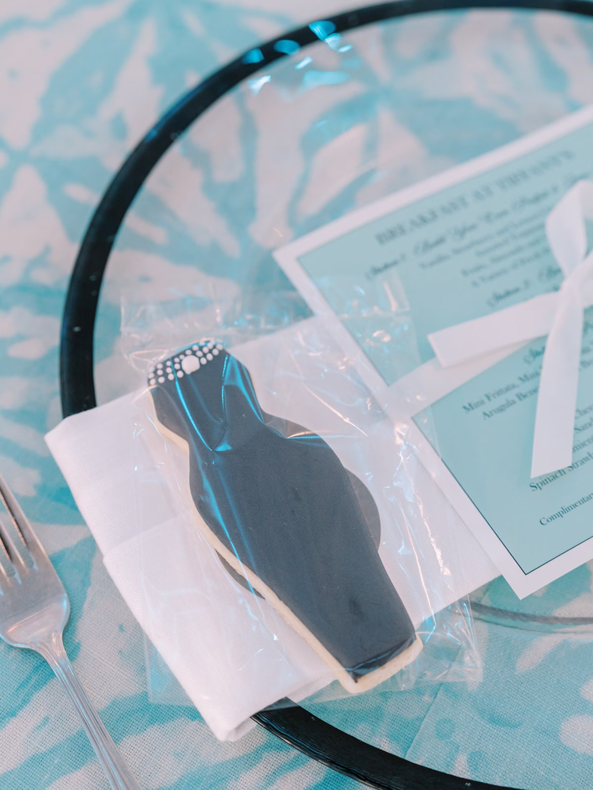 Breakfast at Tiffanys Blue Inspired Wedding Bridal Shower Ideas | Black Glass Rimmed Chargers with Dress Cookie Favors