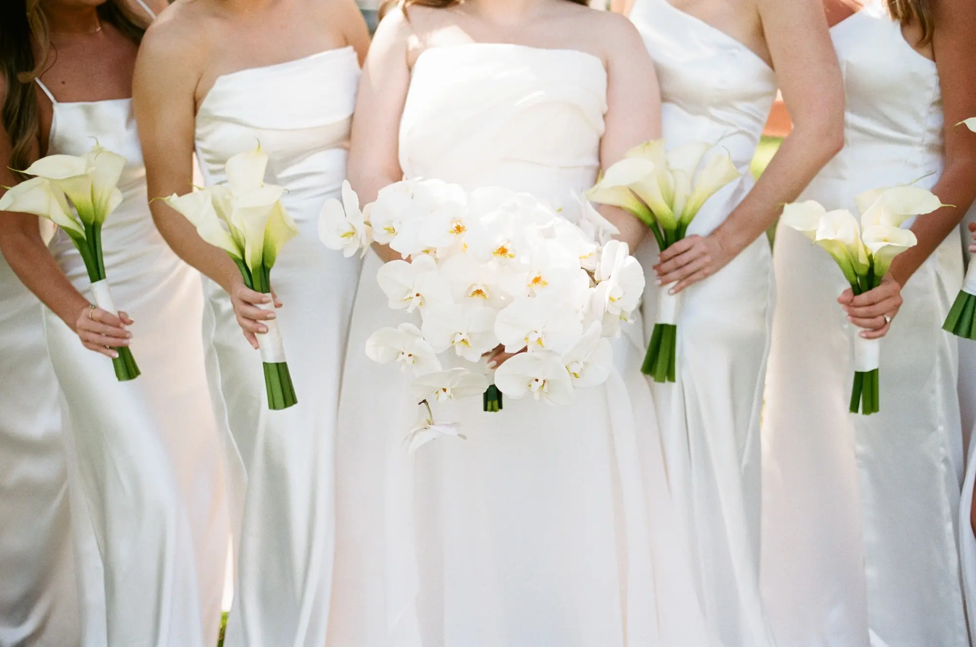 Bride and Bridesmaid Wedding Portrait | Timeless Mismatched White Satin Bridesmaid Dress Inspiration | White Lilies Bouquet Ideas | Cascading White Orchid Bridal Bouquet Inspiration