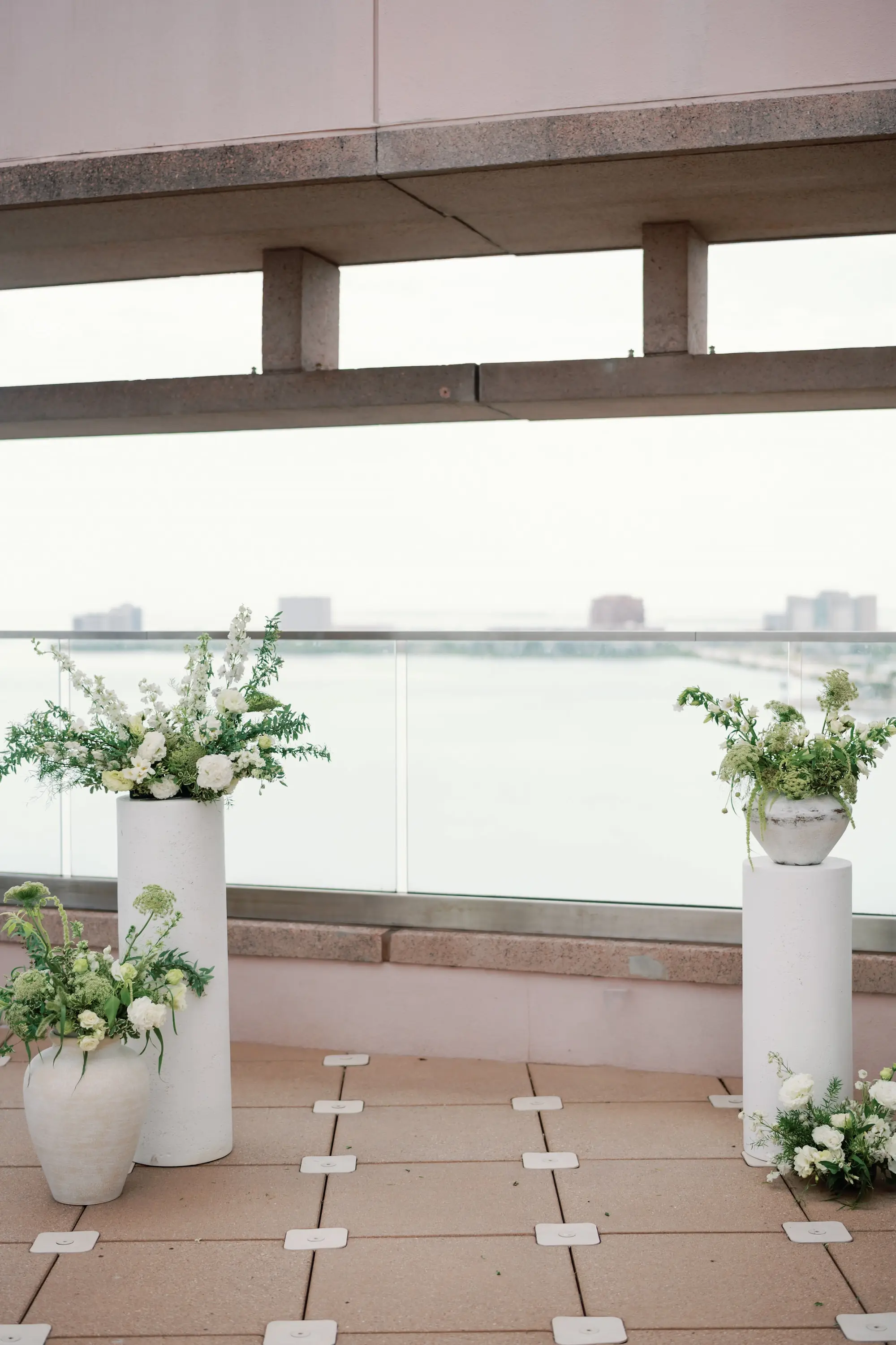 Fresh, Organic White Roses, Wisteria, Carnation Flowers with Fern, Eucalyptus, and Greenery Floral Arrangement Wedding Ceremony Altar Decor Inspiration