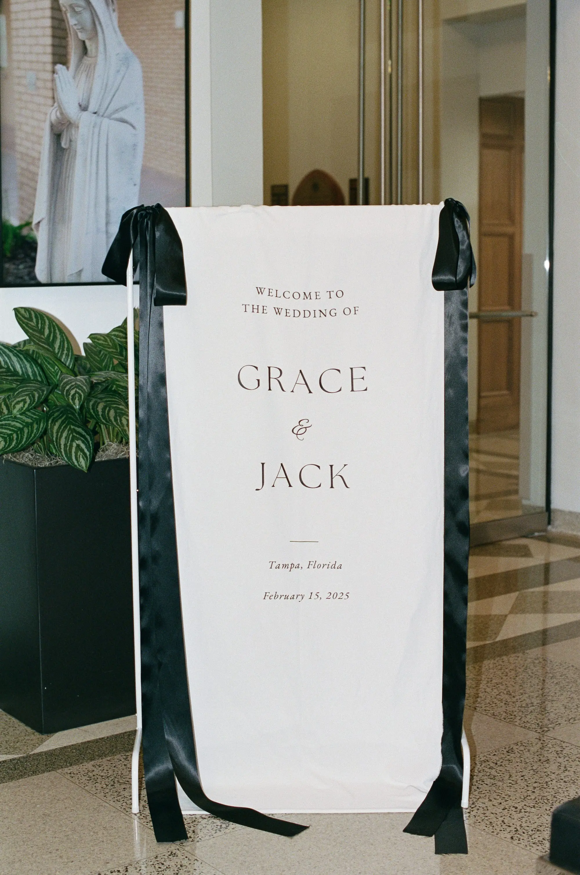 Elegant White Linen Wedding Ceremony Welcome Sign with Satin Black Bows Decor Inspiration
