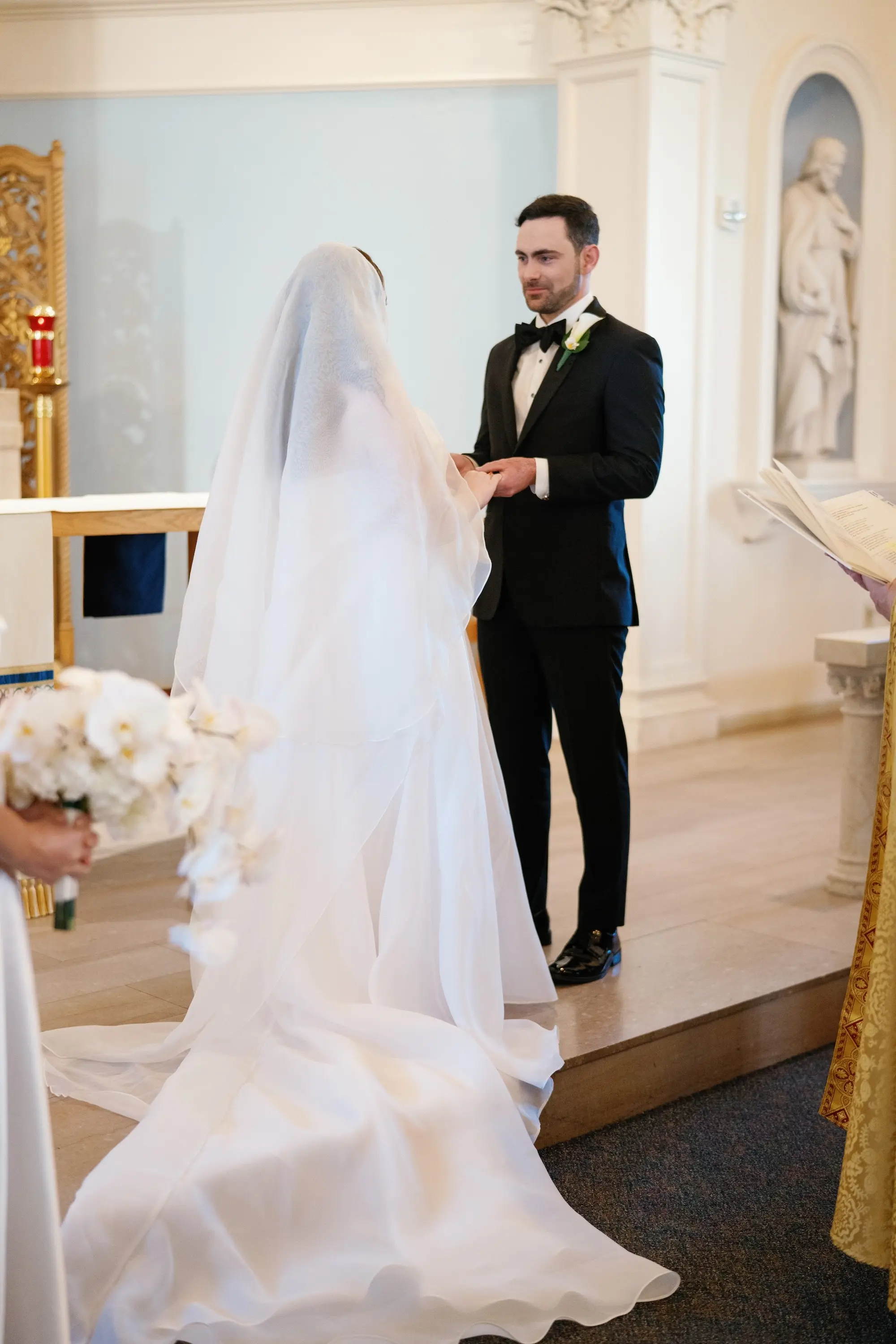 Bride and Groom Wedding Ceremony Ring Exchange Wedding Portrait | Traditional Catholic Church Tampa Bay Wedding Ceremony Academy of Holy Names