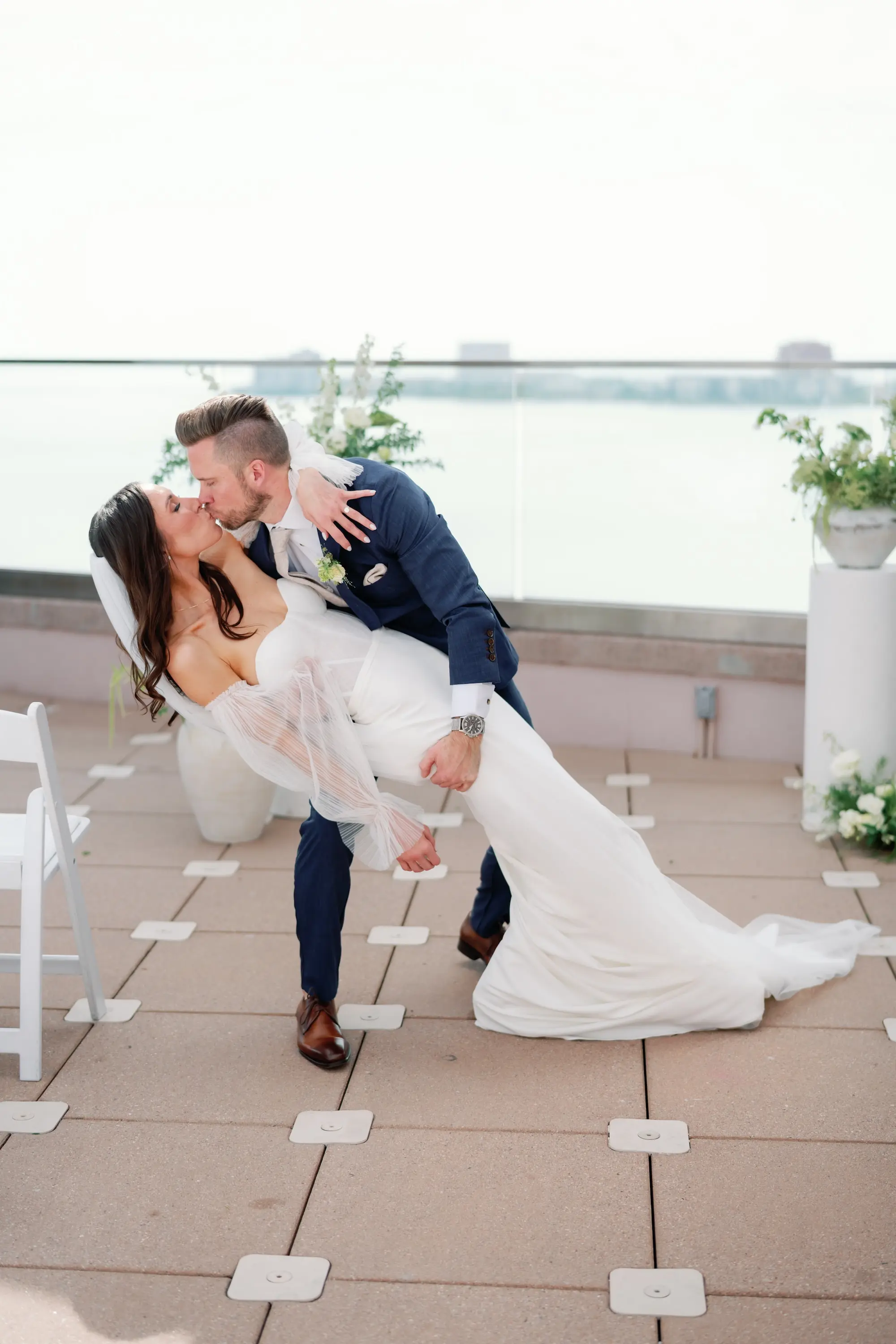 Bride and Groom Kissing Wedding Ceremony Portrait | Waterfront Balcony Wedding Ceremony Inspiration | Florida Event Venue Grand Hyatt Tampa Bay