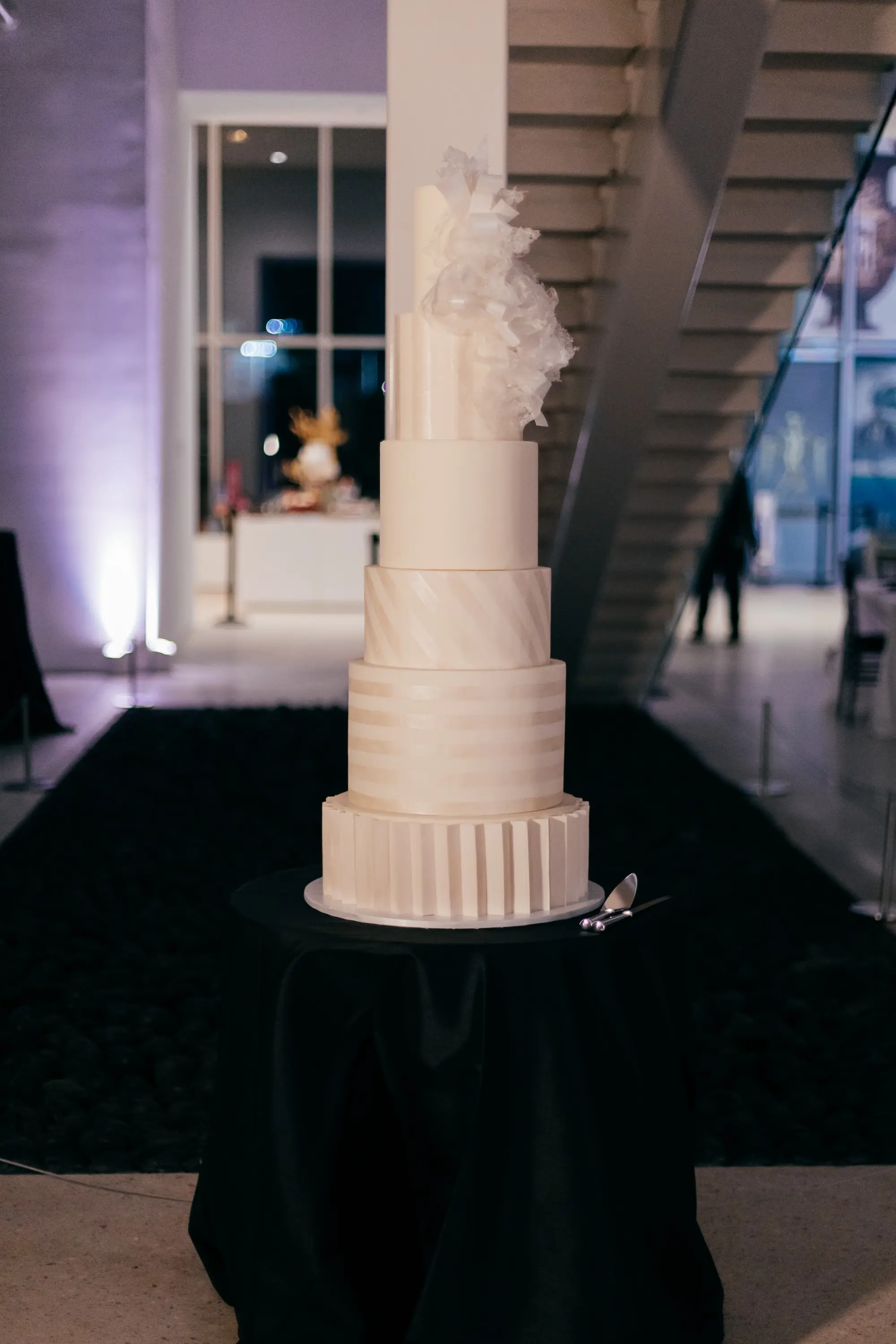 Six Tier Monochromatic White Wedding Cake with Different Patterned Tiers Inspiration