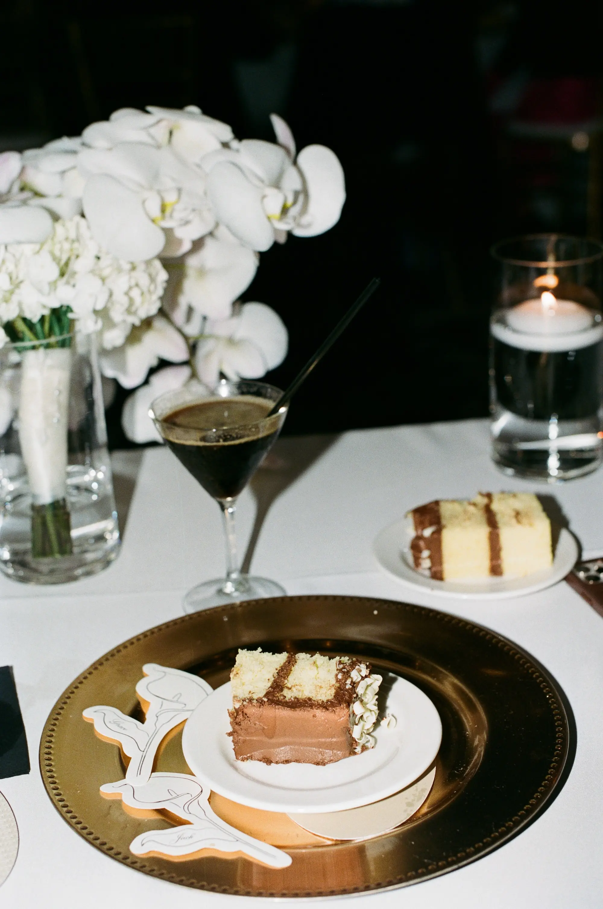 Gold Charger with White Plate Wedding Reception Tablescape Decor Inspiration | White Florals and Romantic Tea Candle Decor Ideas