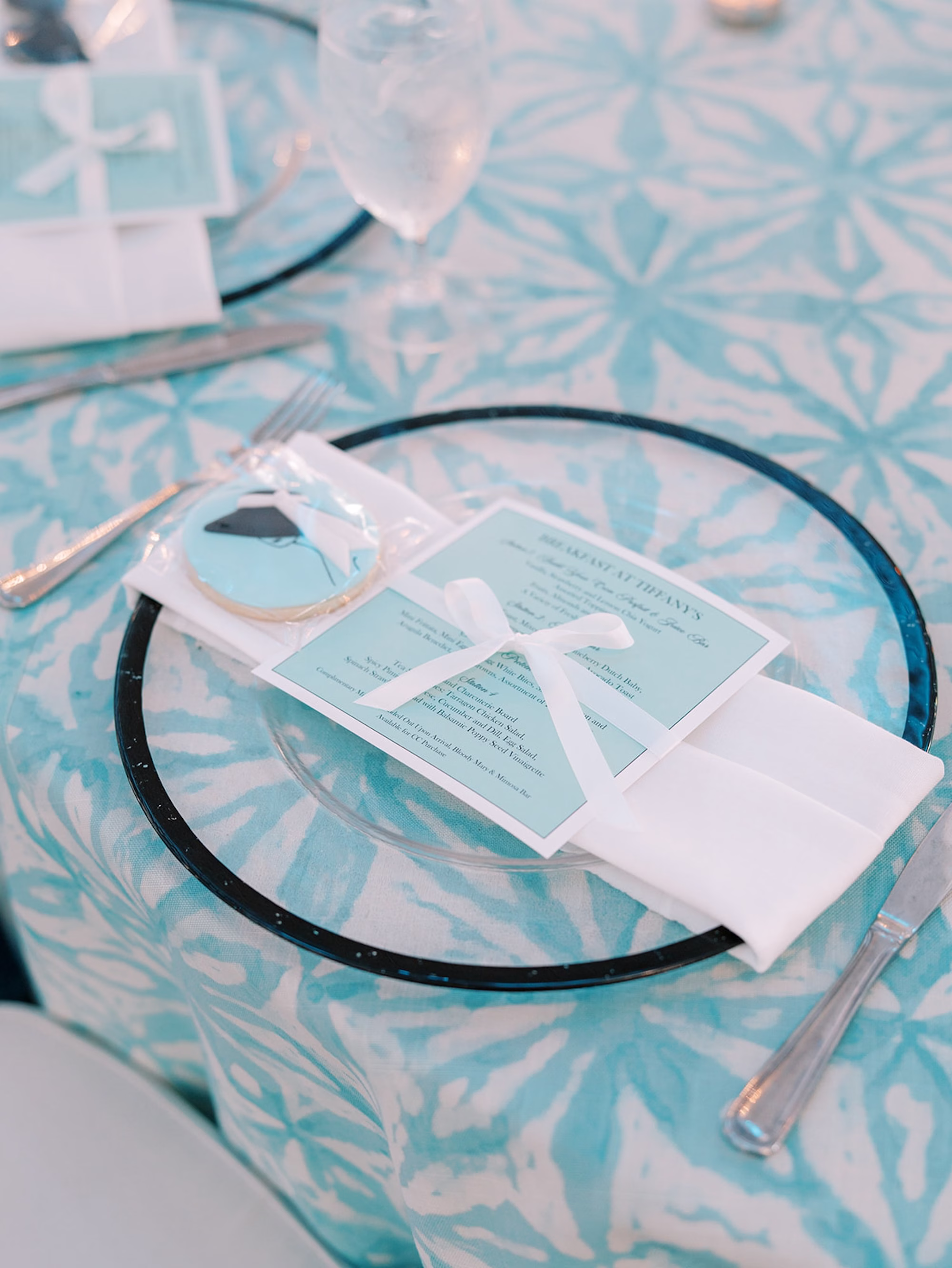 Breakfast at Tiffanys Blue Inspired Wedding Bridal Shower Ideas | Black Glass Rimmed Chargers with Menu | St Pete Rentals A Chair Affair
