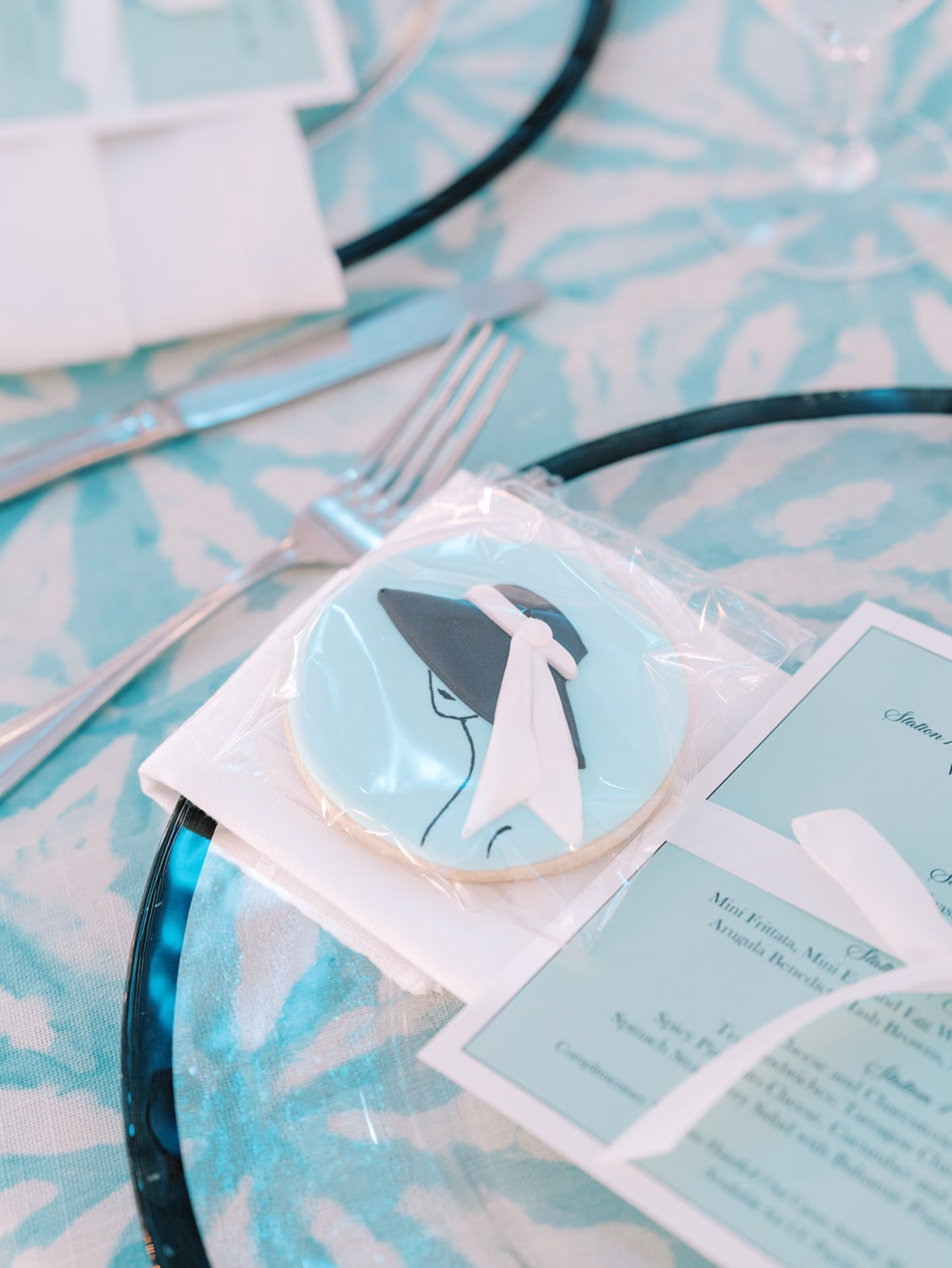 Breakfast at Tiffanys Blue Inspired Wedding Bridal Shower Ideas | Black Glass Rimmed Chargers with Cookie Favors