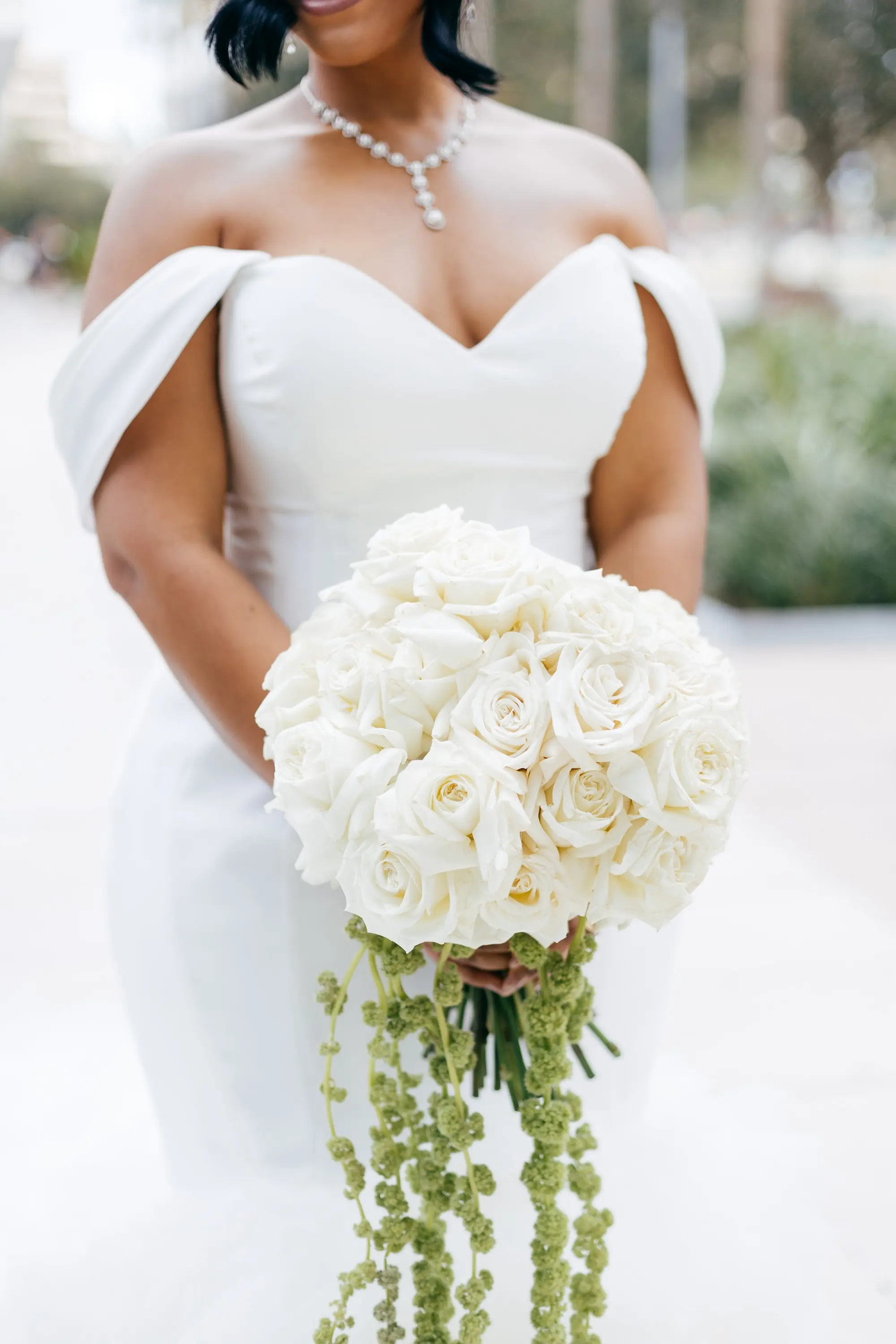 Monochromatic White Roses Bridal Wedding Bouquet with Hanging Greenery Inspiration | White, Off-the-Shoulder Wedding Gown with Sweetheart Neckline Ideas