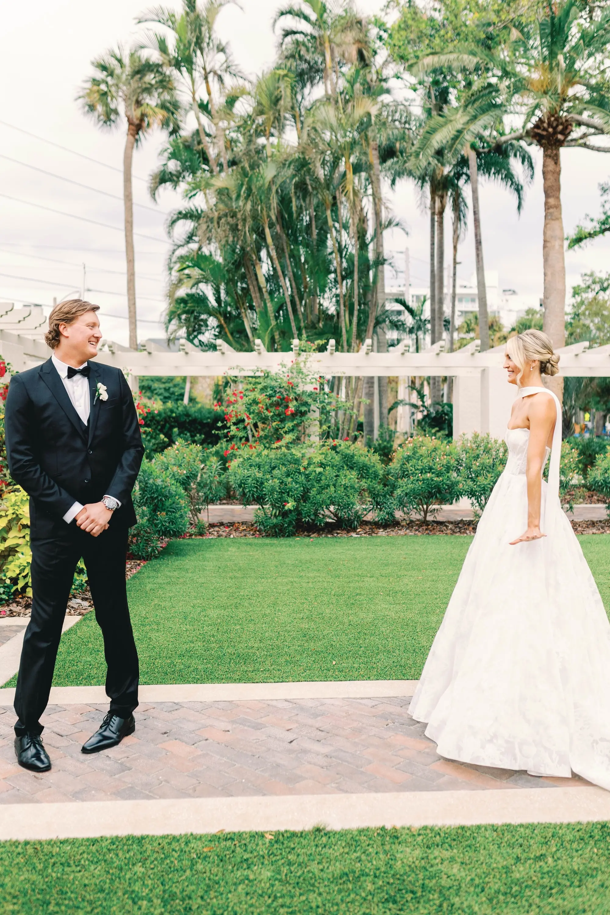 14Classic White and Green Wedding Ideas - Classic, White and Green St. Pete Wedding | The James Museum of Western & Wildlife Art Bride and Groom First Look Wedding Portrait | White Strapless Full Skirt Wedding Gown Inspiration