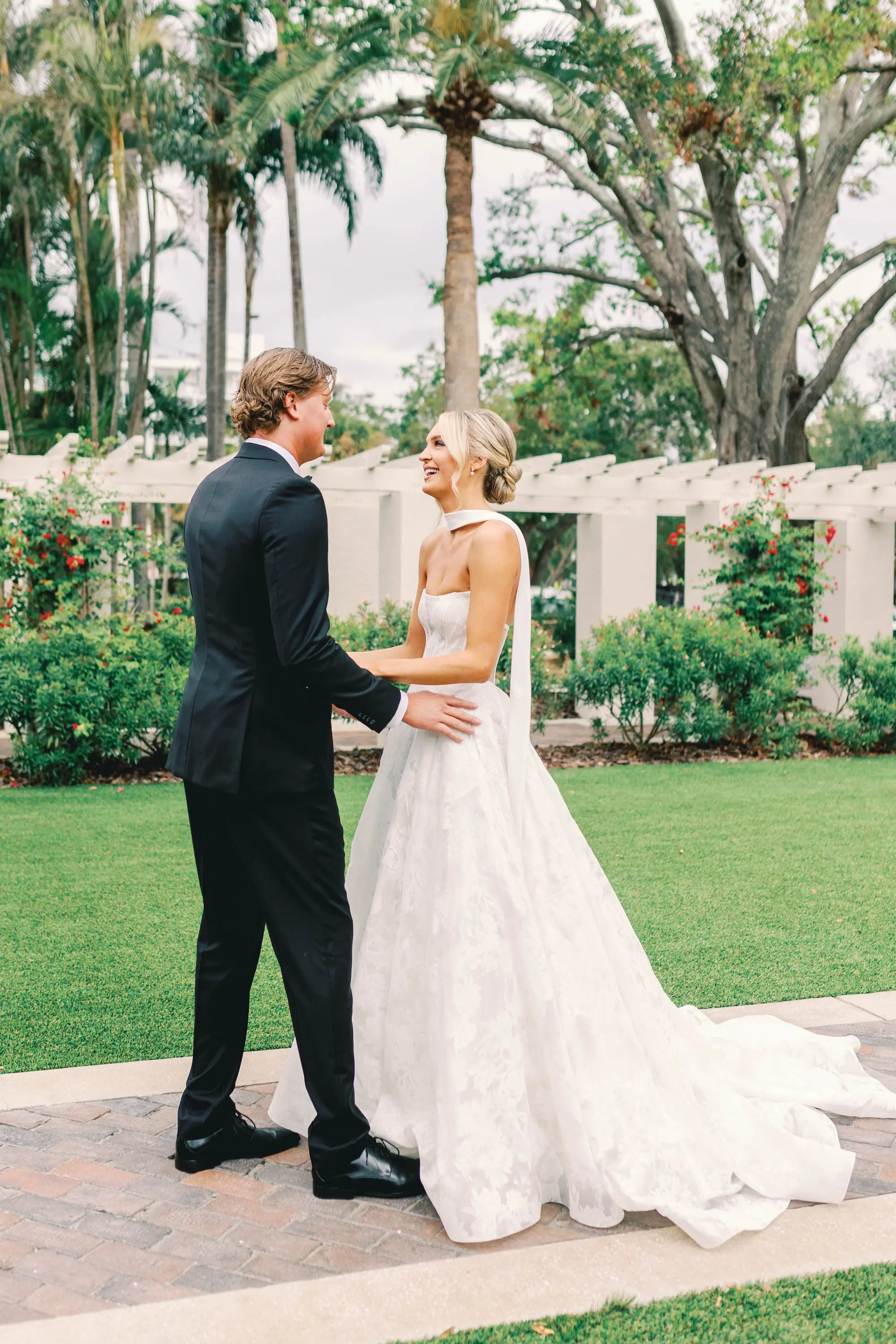 15Classic White and Green Wedding Ideas - Classic, White and Green St. Pete Wedding | The James Museum of Western & Wildlife Art Bride and Groom First Look Wedding Portrait | White Strapless Full Skirt with Elegant Scarf Wedding Gown Inspiration