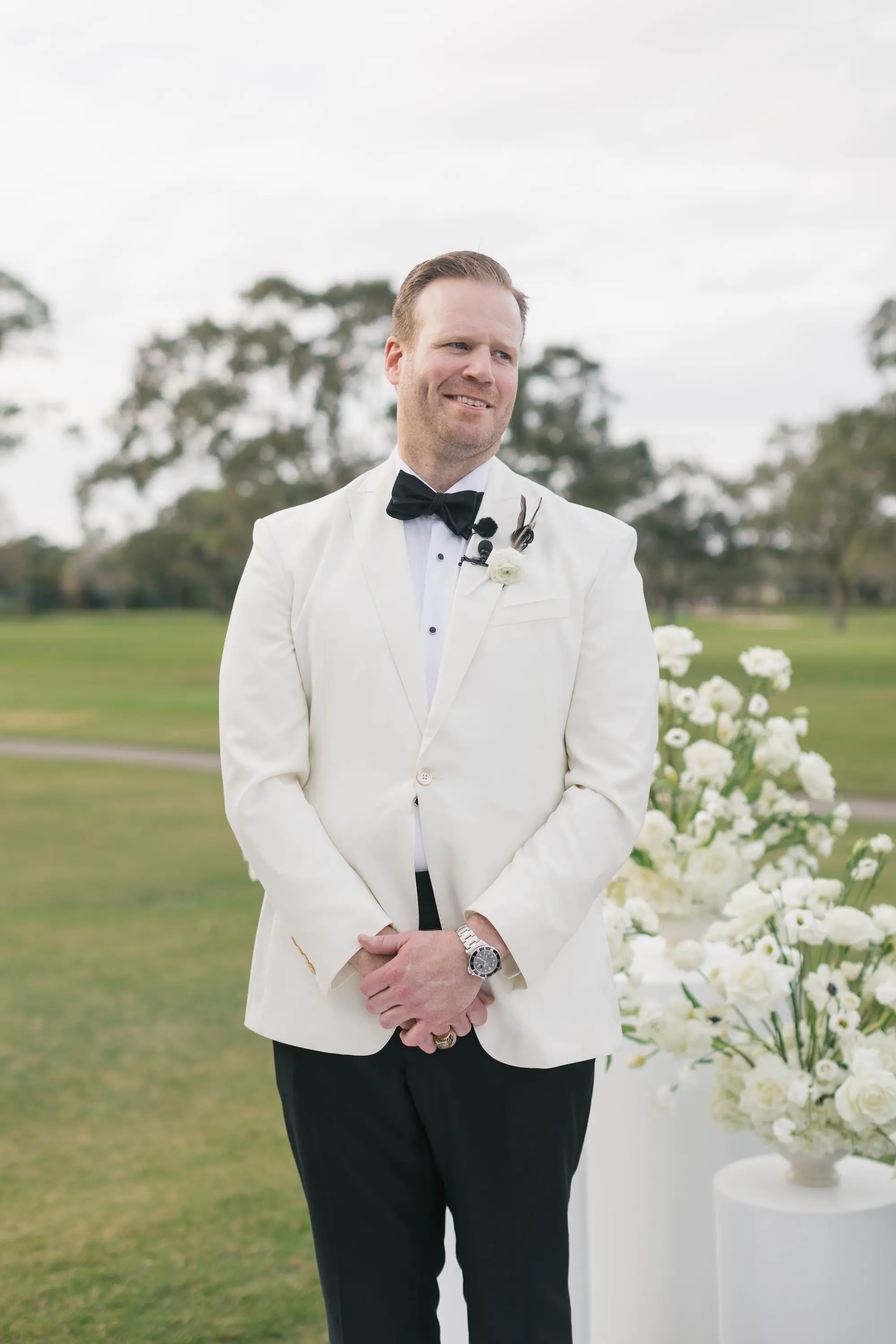 Groom's Reaction to Bride Walking Down Wedding Aisle | White and Black Tuxedo Inspiration