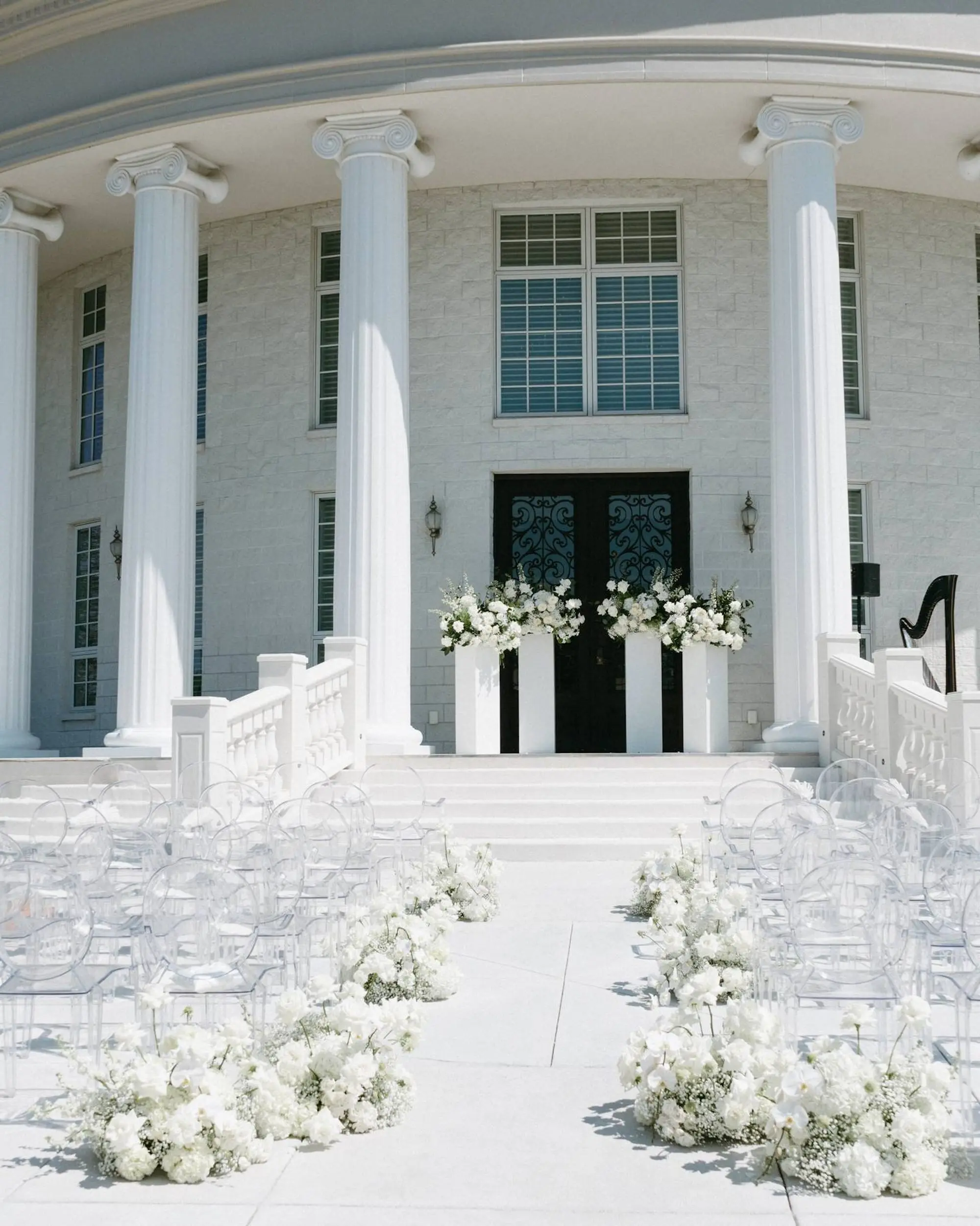 Romantic Monochromatic White Wedding Ceremony Decor Ideas | Modern White Ghost Ceremony Chairs Inspiration | Neoclassical Architectural Tarpon Springs Wedding Venue Whitehurst Gallery