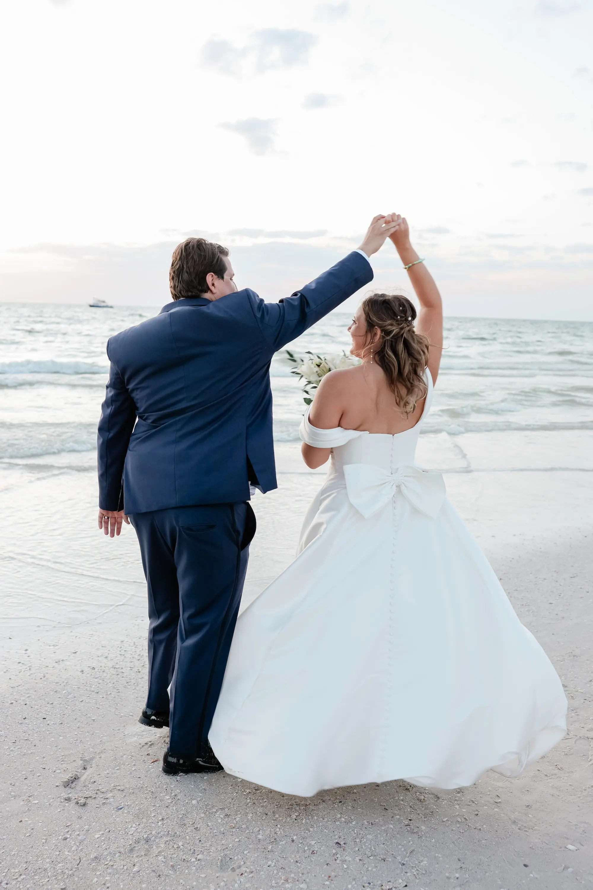 Bride and Groom Clearwater Beach Wedding Portrait | White Off-the-Shoulder Wedding Ballgown with Full Skirt and Large, Bow Detail Inspiration | St Pete Photographer Lifelong Photography Studio