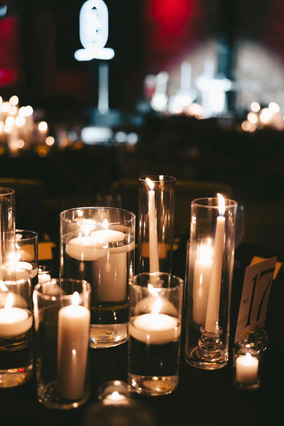 Different Size Romantic Floating Candles and Taper Candles Wedding Reception Table Decor Inspiration | Tampa Bay Planner Coastal Coordinating