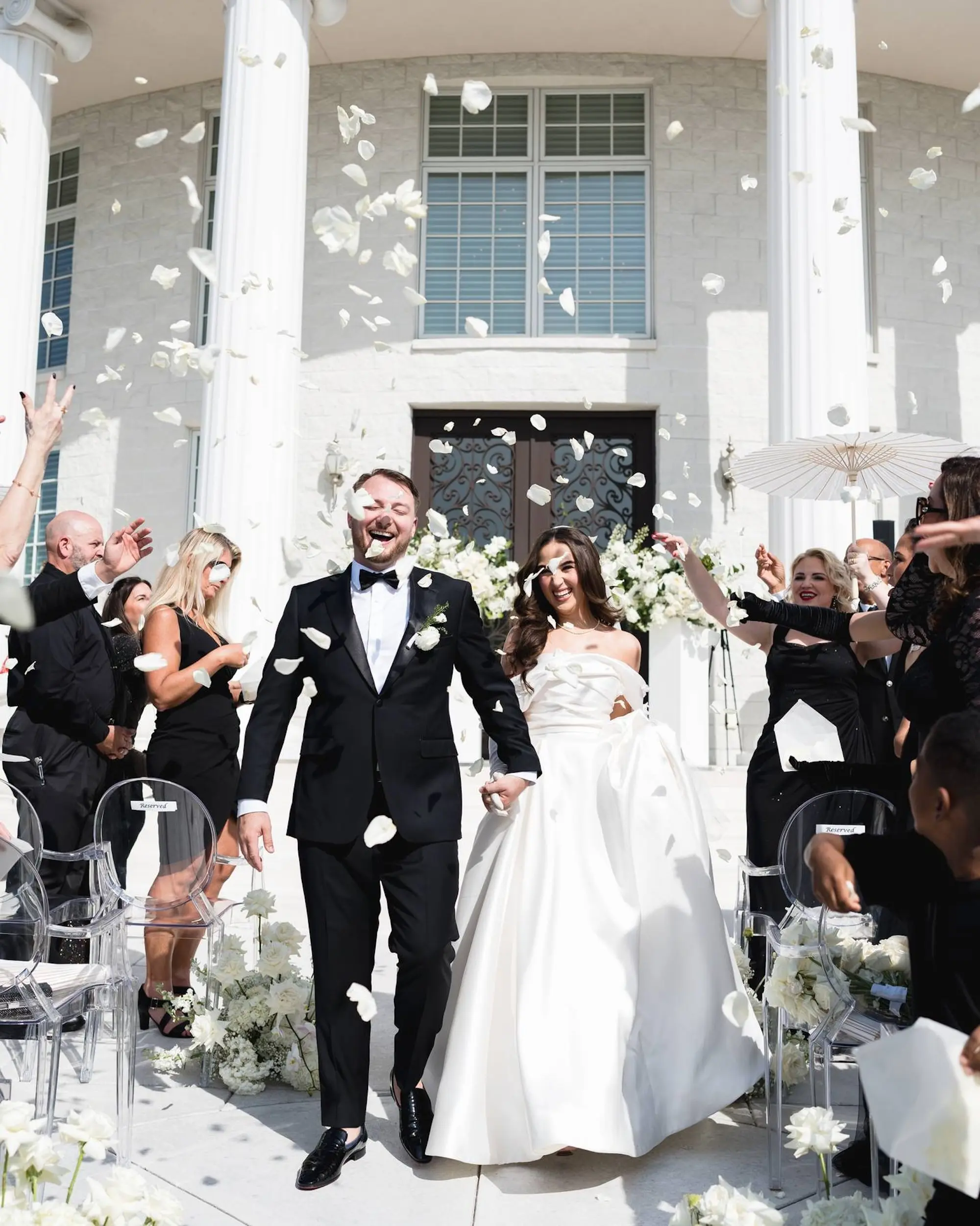 Bride and Groom Just Married Wedding Ceremony Portrait | White Rose Petals Wedding Ceremony Celebration Inspiration | Monochromatic White Floral Arrangements Ceremony Aisle Decor Ideas