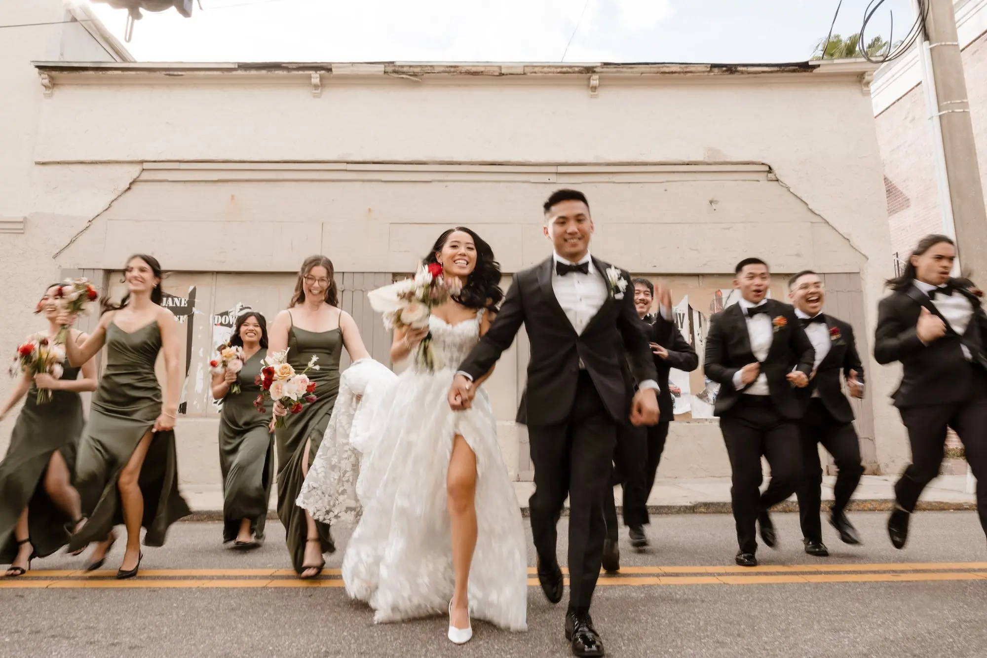 25Modern Romantic Wedding Inspiration - Modern, Moody Fall Ybor City Wedding | Hotel Haya Bride and Groom Downtown with Bridal Party Wedding Portrait | Mismatched Satin Olive Green Bridesmaid Dresses Inspiration | Tampa Bay Photographer Evoke Photo and Film