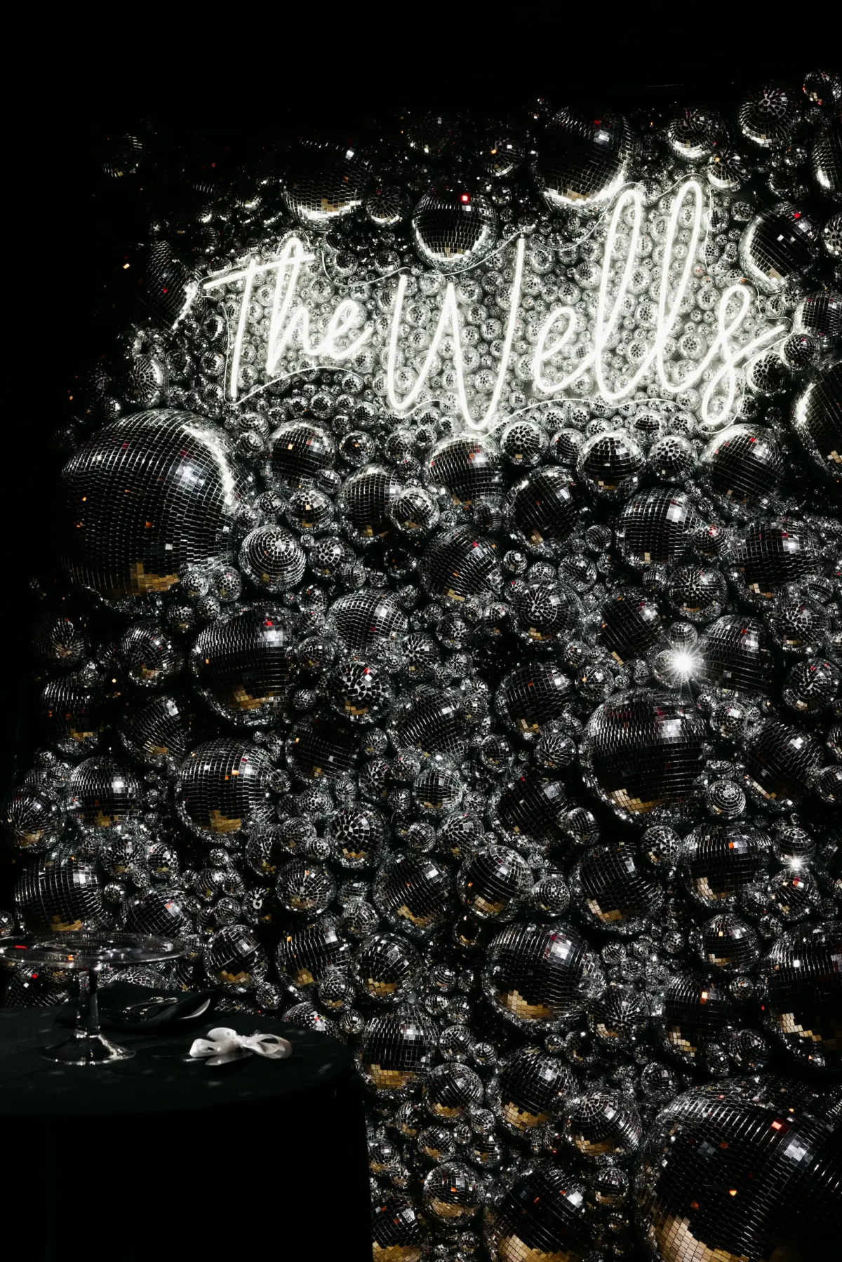 Disco Ball Wall with Last Name Neon Sign New Years Eve Wedding Reception Decor Inspiration | Tampa Bay Planner Coastal Coordinating