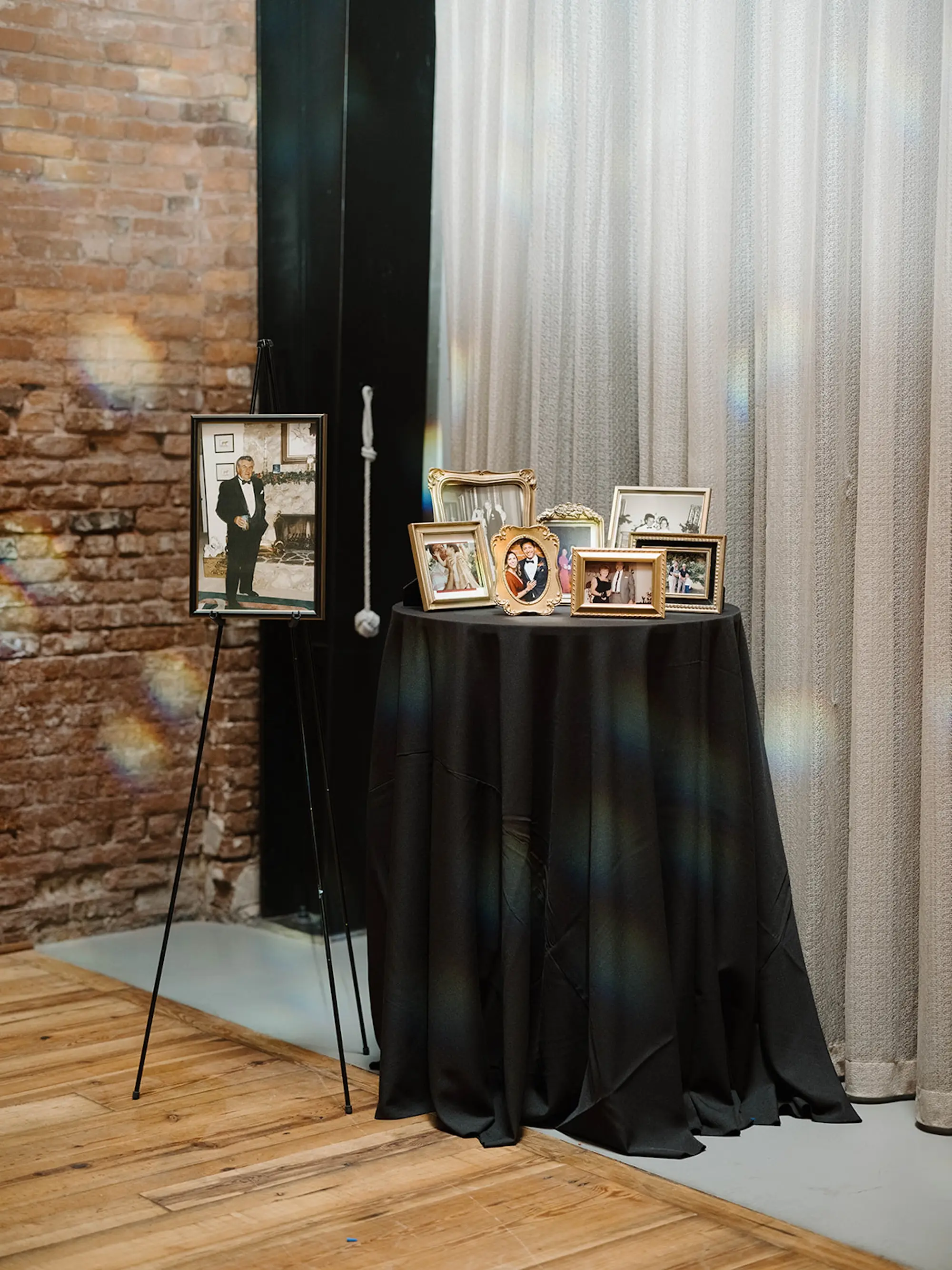 Black Linens for Gold Framed Pictures In Remembrance Wedding Reception Decor Inspiration | Tampa Bay Planner Planner Coastal Coordinating