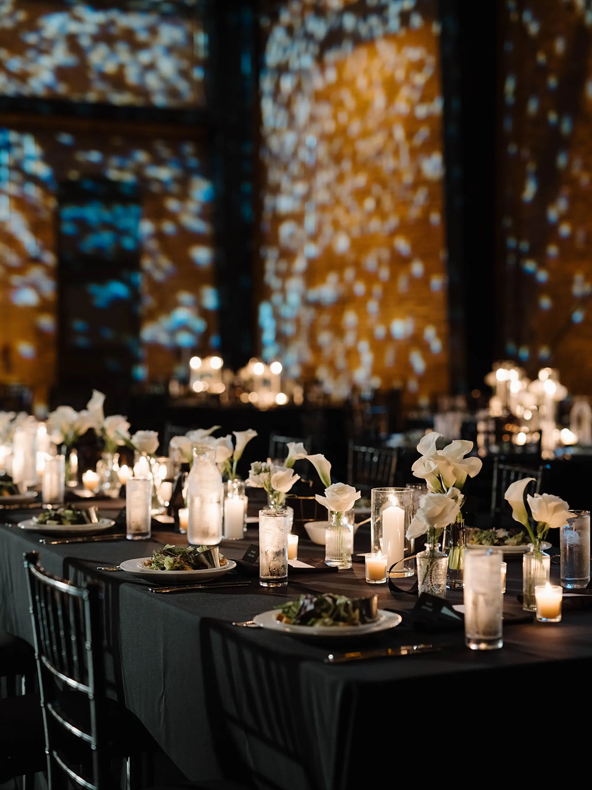 Moody Modern Monochromatic Black Tie Romantic Candlelit Indoor Wedding Reception Inspiration | Single Stem Calla Lilies in Bud Vases Wedding Reception Table Decor Ideas | Florist Save The Date Florida | St Pete Event Planner Coastal Coordinating | Downtown Tampa Heights Event Venue Armature Works