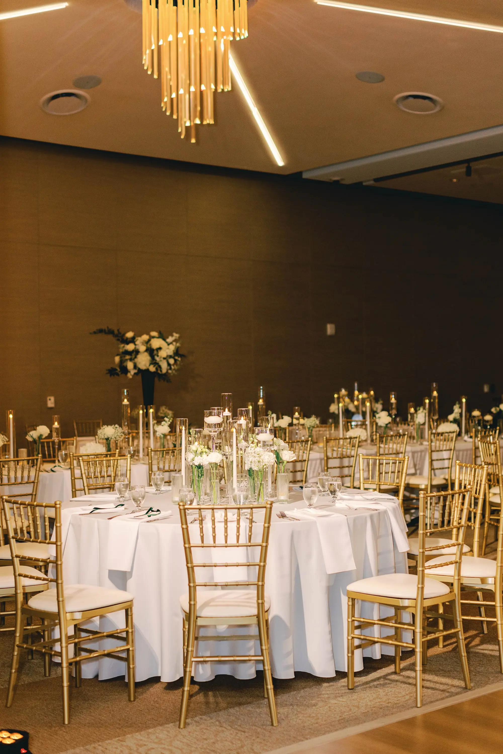 33Classic White and Green Wedding Ideas - Classic, White and Green St. Pete Wedding | The James Museum of Western & Wildlife Art Timeless Black and White Museum Ballroom Wedding Reception | White Linens and Gold Chiavari Chairs | Classic White Baby's Breath and Green Stems Arrangements Centerpiece Decor Inspiration | Floating Tea Candles Table Decor Ideas | St. Pete Wedding Venue The James Museum | Kate Ryan Event Rentals