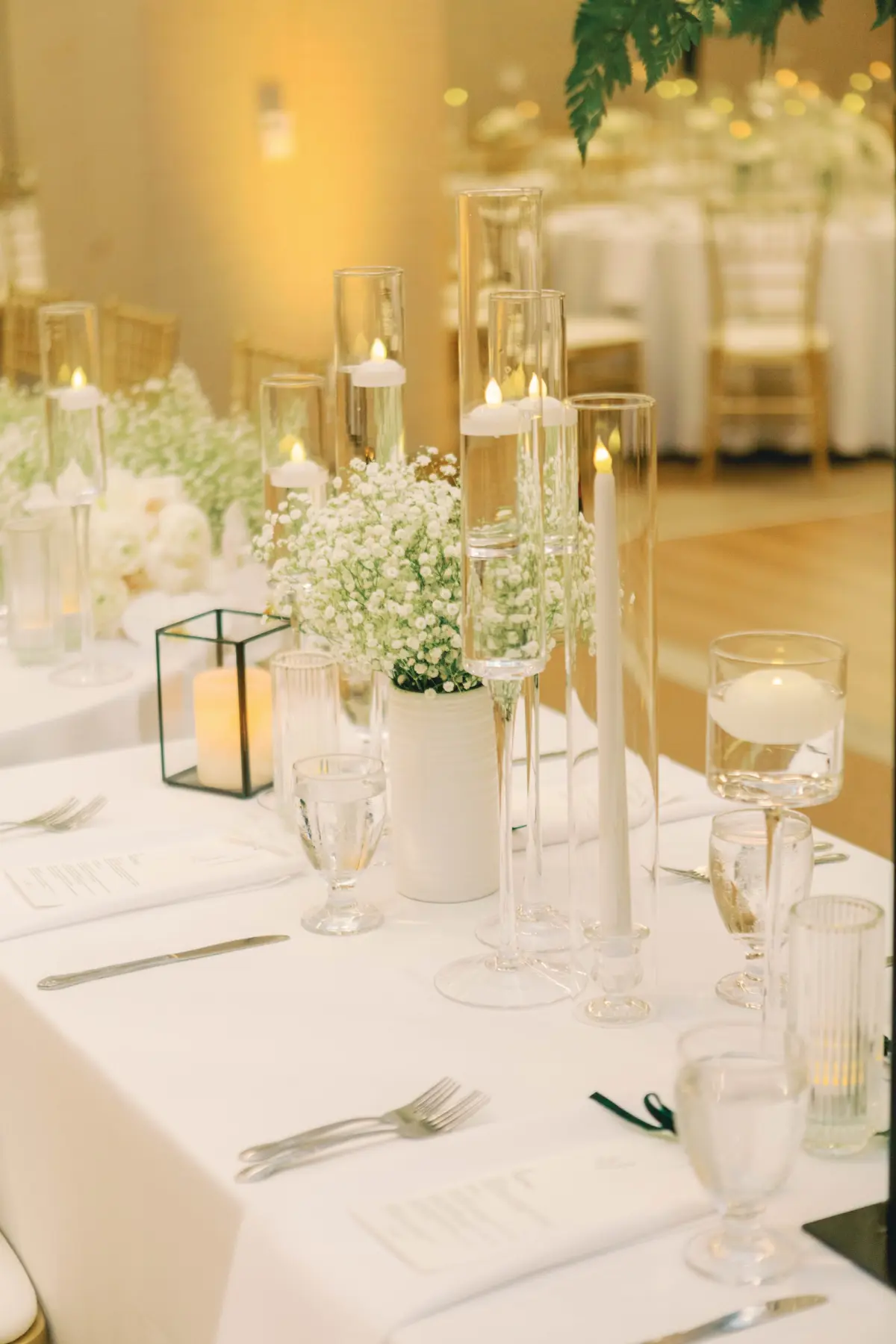 35Classic White and Green Wedding Ideas - Classic, White and Green St. Pete Wedding | The James Museum of Western & Wildlife Art Timeless Black and White Museum Ballroom Wedding Reception | White Baby's Breath Floral Decor Inspiration | White Linens with Romantic Taper and Floating Candles Tablescape Decor Ideas | Kate Ryan Event Rentals