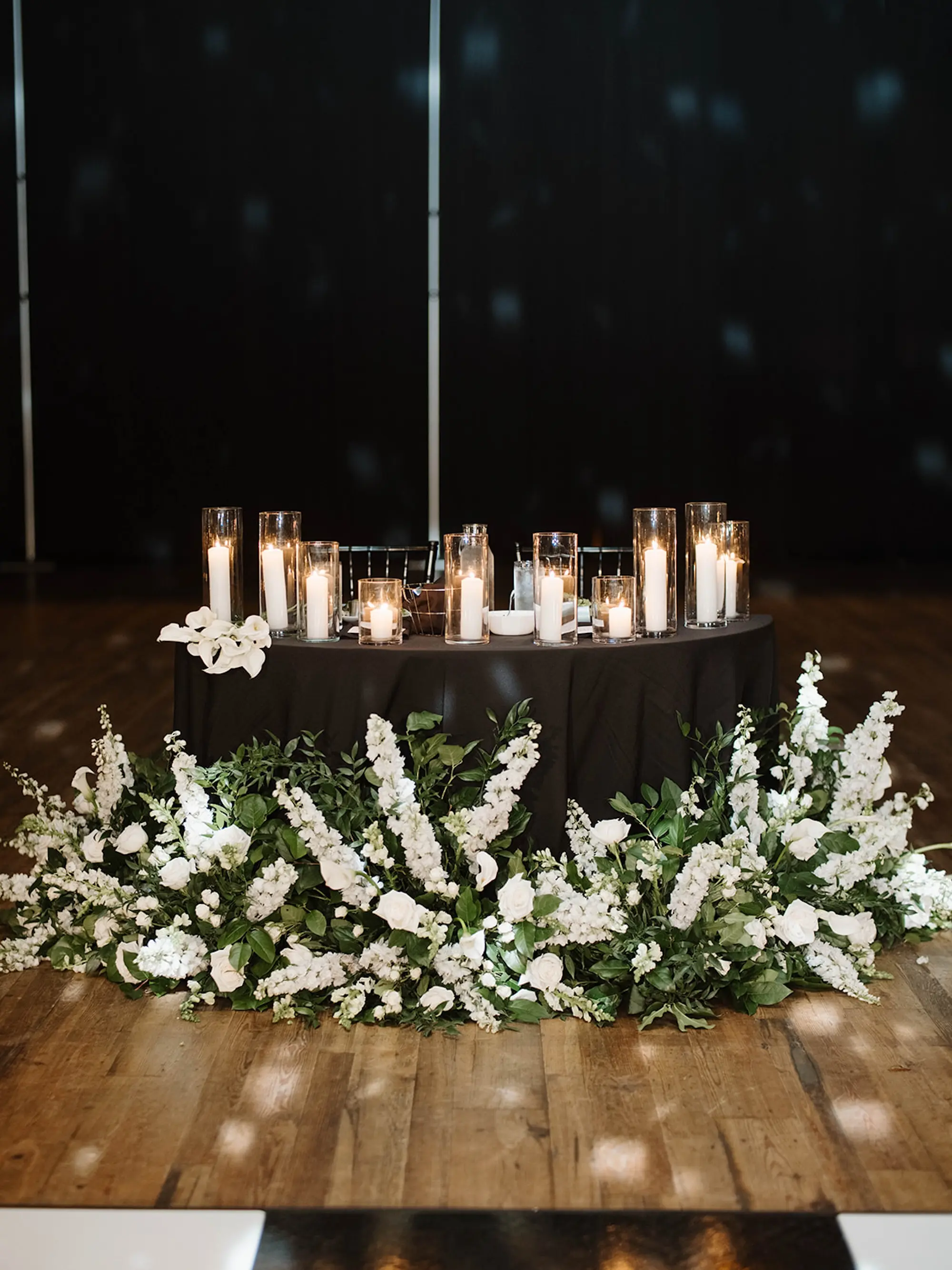 Moody Modern Monochromatic Black Tie Romantic Candlelit Indoor Wedding Reception Sweetheart Inspiration | White Wisteria, Lilies, Roses with Eucalyptus and Ferns Greenery Floral Arrangement Decor Ideas | Florist Save The Date Florida | St Pete Event Planner Coastal Coordinating
