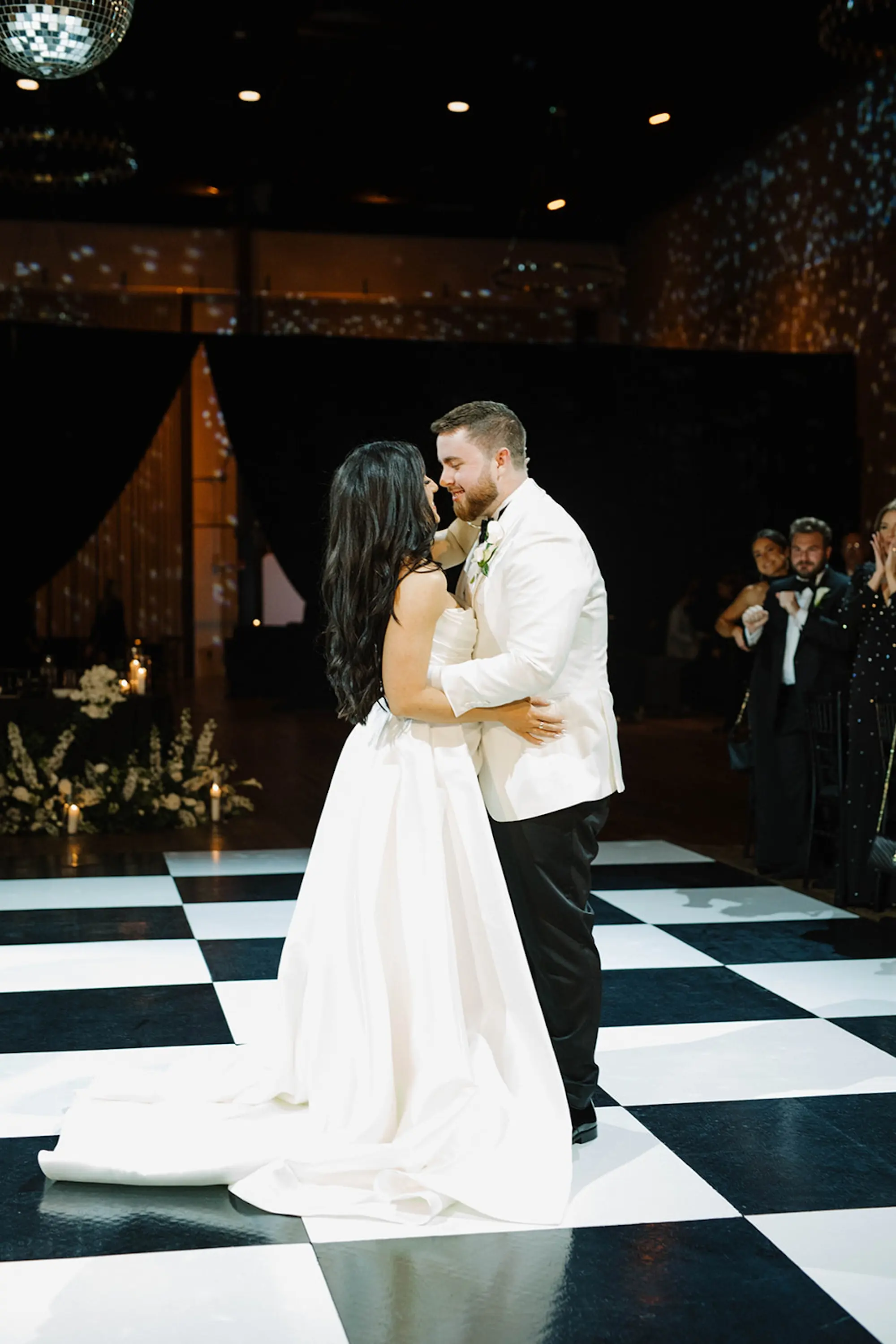 Bride and Groom First Dance Wedding Portrait | Modern, Chic Checkered Black and White Dance Floor Ideas | Disco Balls Wedding Reception Decor Inspiration | Tampa Bay Planner Planner Coastal Coordinating