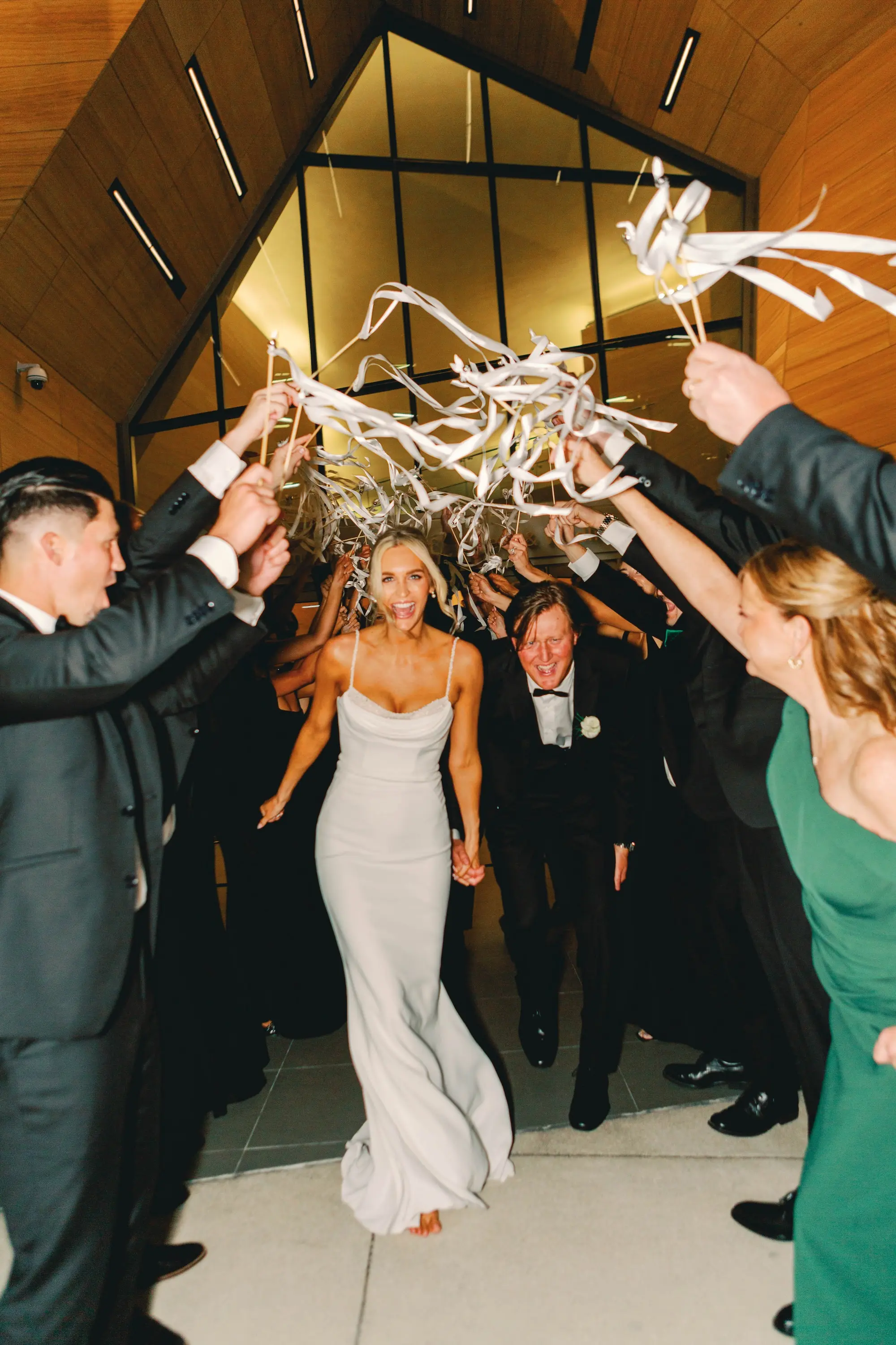 38Classic White and Green Wedding Ideas - Classic, White and Green St. Pete Wedding | The James Museum of Western & Wildlife Art Bride and Groom White Ribbon Wedding Reception Exit Ideas | Timeless Fitted White Cowl Neck Wedding Reception Stella York Slip Dress with Spaghetti Straps Ideas