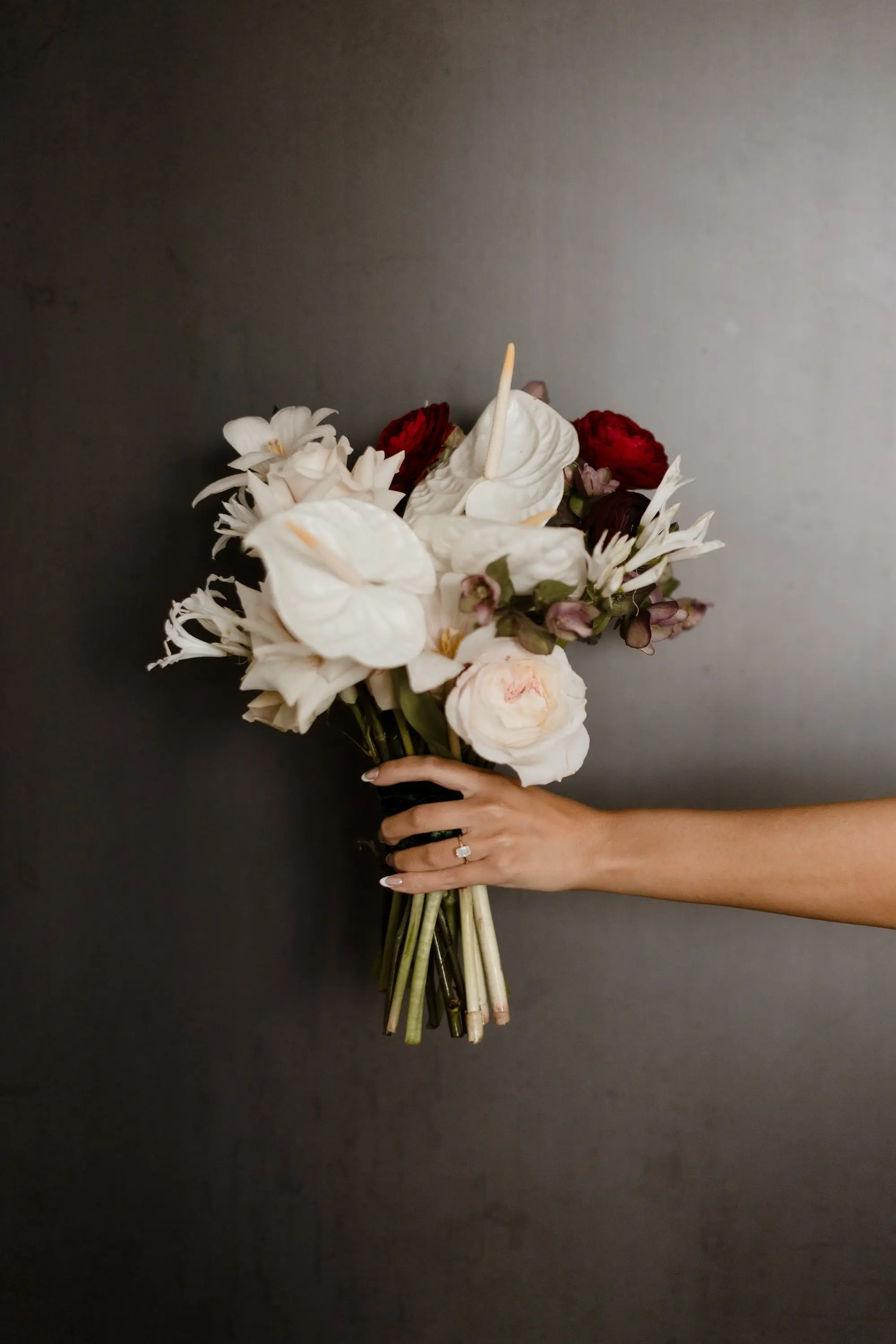 3Modern Romantic Wedding Inspiration - Modern, Moody Fall Ybor City Wedding | Hotel Haya White, Cream, Crimson Florals with Long Stems Bridal Wedding Bouquet Inspiration | White Anthurium, White Roses, Crimson Roses Bouquet Ideas