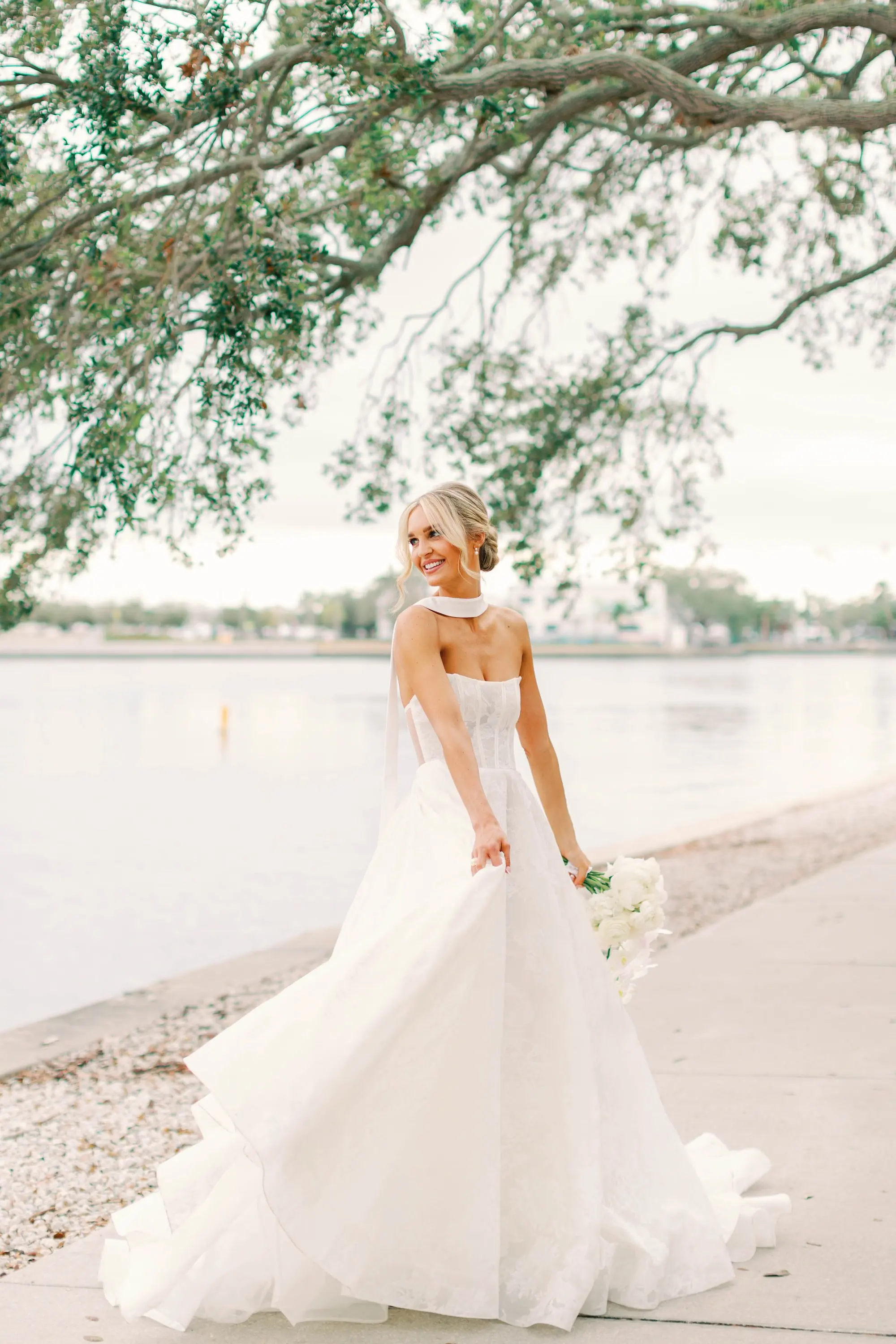 9Classic White and Green Wedding Ideas - Classic, White and Green St. Pete Wedding | The James Museum of Western & Wildlife Art Bride Outdoor Winter Wedding Portrait | Elegant White Alyne by Rita Vinieris Wedding Gown Ballgown Skirt and Fitted Bodice and White Scarf Inspiration | Classic White Roses and Orchids Bridal Bouquet Ideas