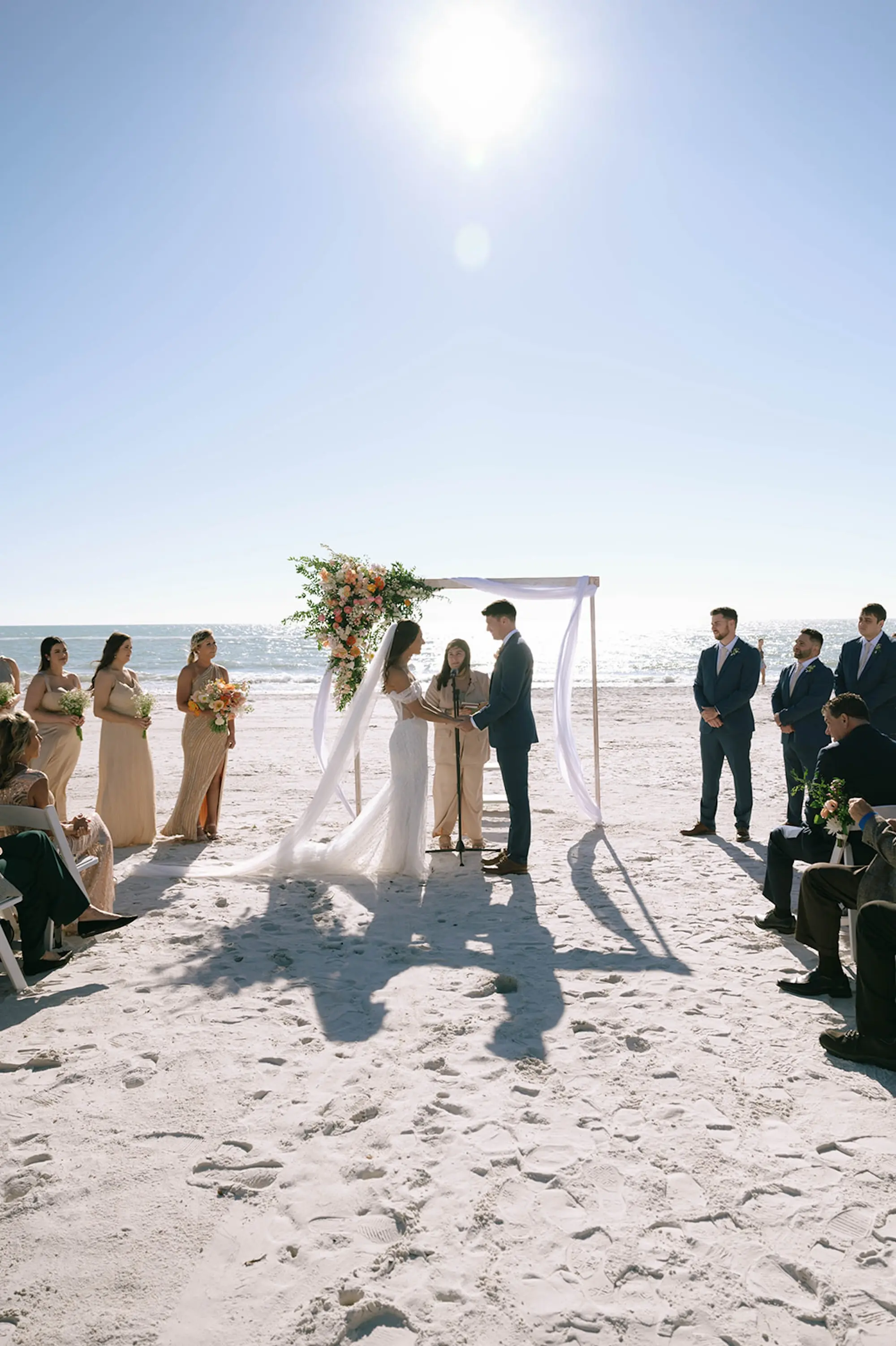 15Modern Italian Peach and Orange Florida Beach Wedding Ideas - Modern, Italian-Inspired Madeira Beach Wedding | The West Events Bride and Groom Beach Waterfront Wedding Ceremony Vow Exchange Wedding | Madeira Beach Venue The West Events Space