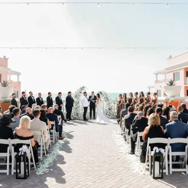 Bride and Groom Wedding Ceremony Vow Exchange Wedding Portrait | White Rose Petals Aisle Decor Inspiration | St Pete Photographer Lifelong Photography Studio | Waterfront Wedding Venue Hyatt Regency Clearwater Beach