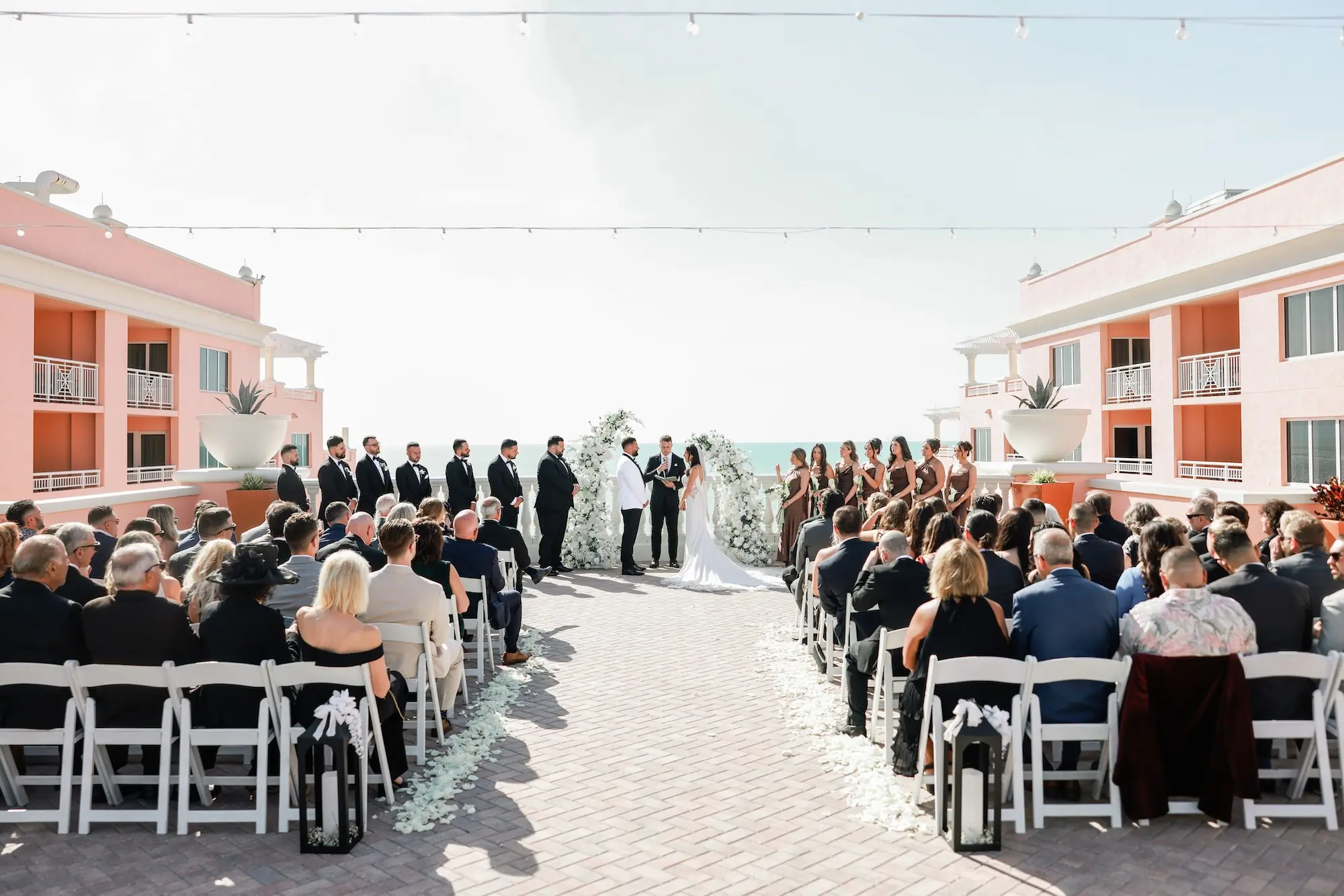 Bride and Groom Wedding Ceremony Vow Exchange Wedding Portrait | White Rose Petals Aisle Decor Inspiration | St Pete Photographer Lifelong Photography Studio | Waterfront Wedding Venue Hyatt Regency Clearwater Beach