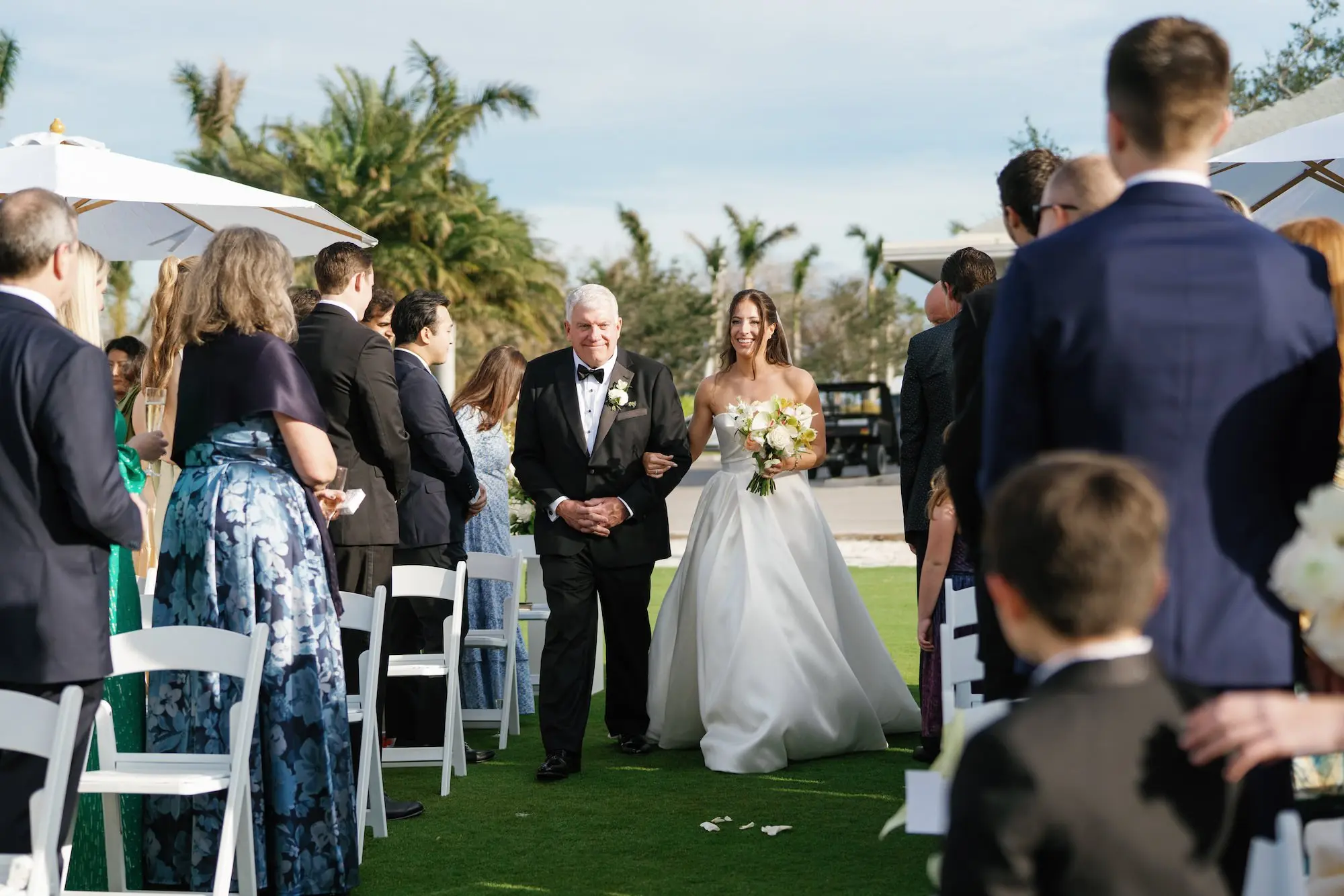 Bride and Father Walking Down Wedding Aisle