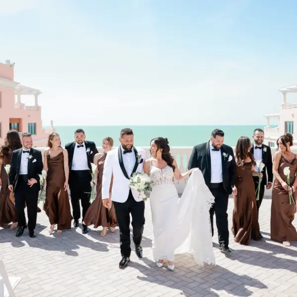 Bride and Groom with Bridal Party Wedding Portrait | Mismatched Styled Chocolate Espresso Brown Satin Bridesmaid Dresses Inspiration | Single White Lilies Bouquet Ideas | St Pete Photographer Lifelong Photography Studio | Waterfront Wedding Venue Hyatt Regency Clearwater Beach