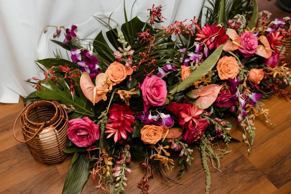 Tropical Red Gingers, Birds of Paradise Monstera Leaf, Palm Leaf, and Fern Greenery Arrangement Wedding Reception Decor Inspiration | Tampa Bay Florist Save The Date Florida