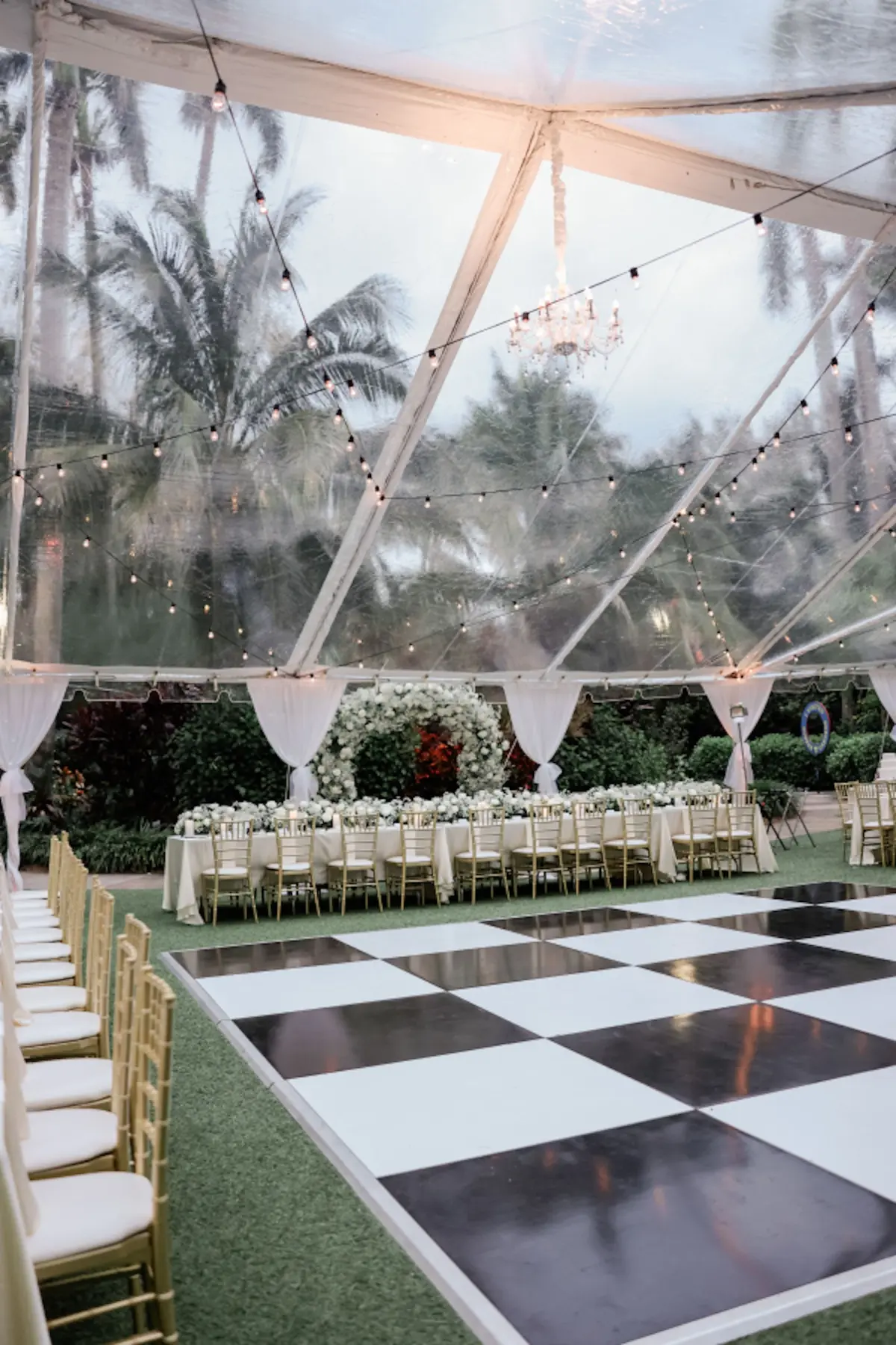 34Elegant Timeless Ivory and Green St Pete Wedding Venue Sunken Gardens - Romantic Outdoor St. Pete Wedding | Sunken Gardens Black and White Checkered Dance Floor Wedding Reception Decor Ideas | Outdoor Tented Wedding Reception with String Lights Decor Inspiration | Tampa Bay Rentals Fiesta Solutions Event Rentals | Venue Sunken Gardens