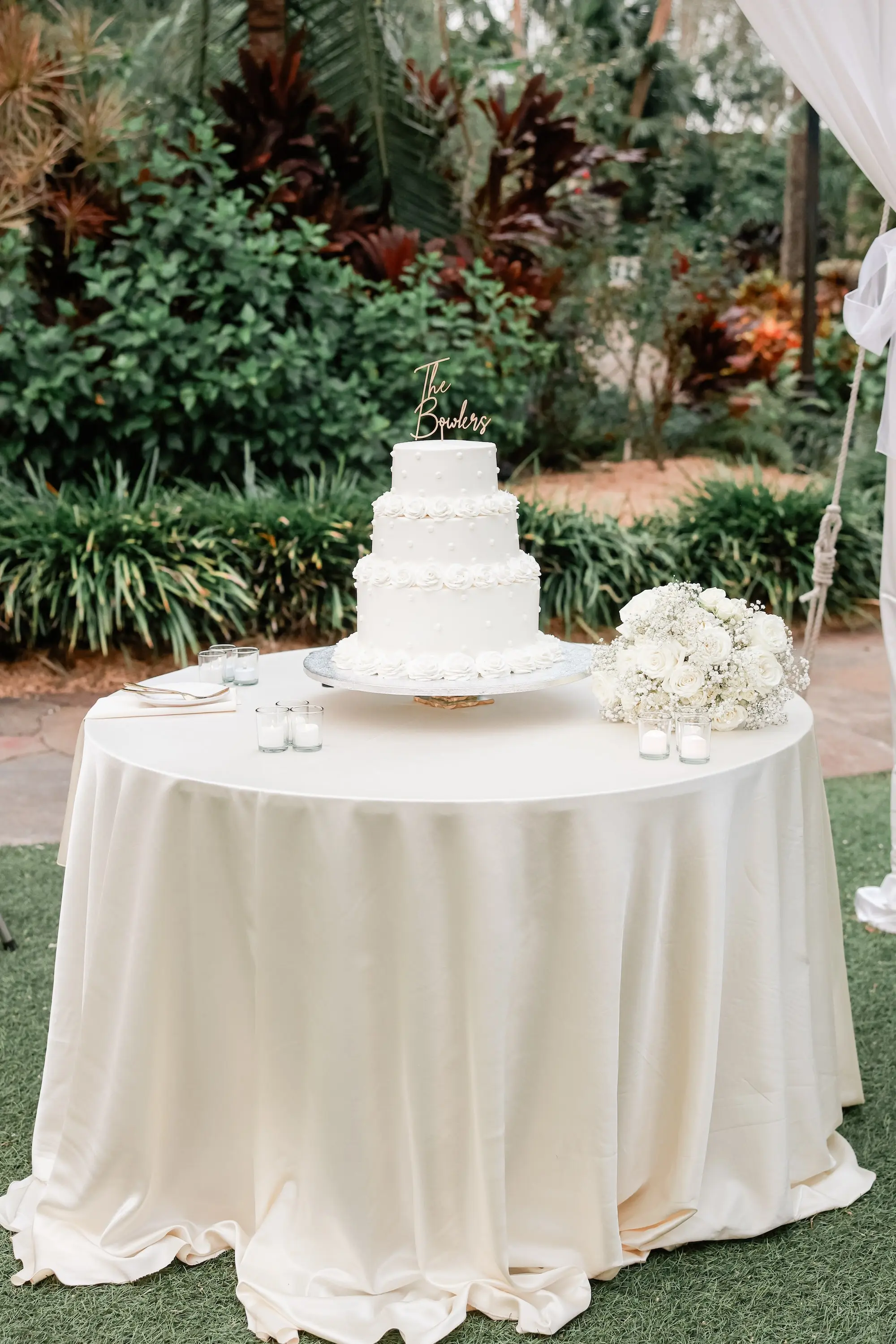 36Elegant Timeless Ivory and Green Garden Wedding - Romantic Outdoor St. Pete Wedding | Sunken Gardens Three Tier White Wedding Cake with Gold Last Name Cake Topper Inspiration | White Roses and Baby's Breath Floral Wedding Reception Decor Ideas | Tampa Bay Rentals Fiesta Solutions Event Rentals
