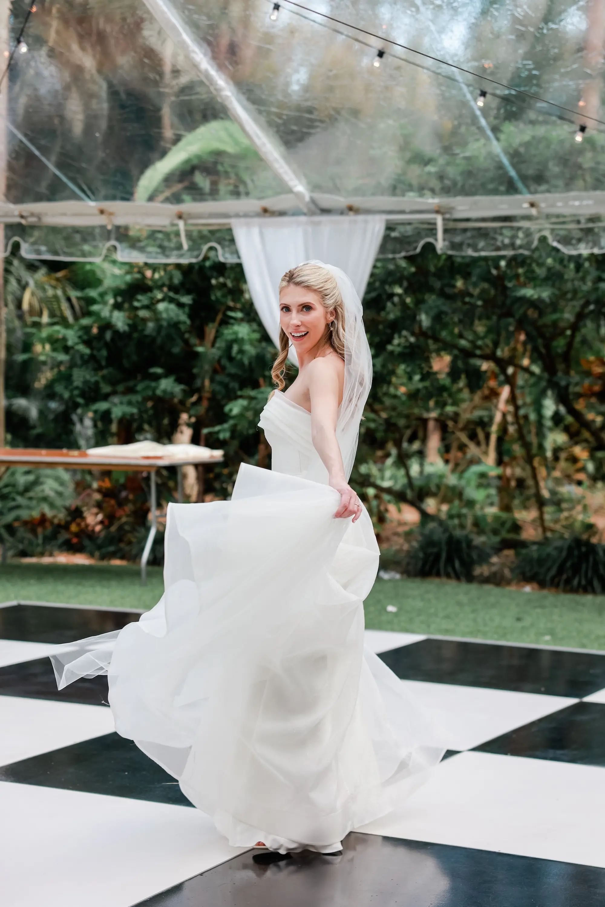 37Elegant Timeless Ivory and Green Garden Wedding - “Best Of” 2025: Wedding Receptions Part 2 Bride on Black and White Wedding Reception Dance Floor Portrait | Soft Half Up Half Down Curls Bridal Hair Inspiration | Fresh, Natural Wedding Makeup Ideas | Sarasota Hair and Makeup Artist Femme Akoi Beauty Studio | St Pete Photographer Lifelong Photography Studio | Venue Sunken Gardens