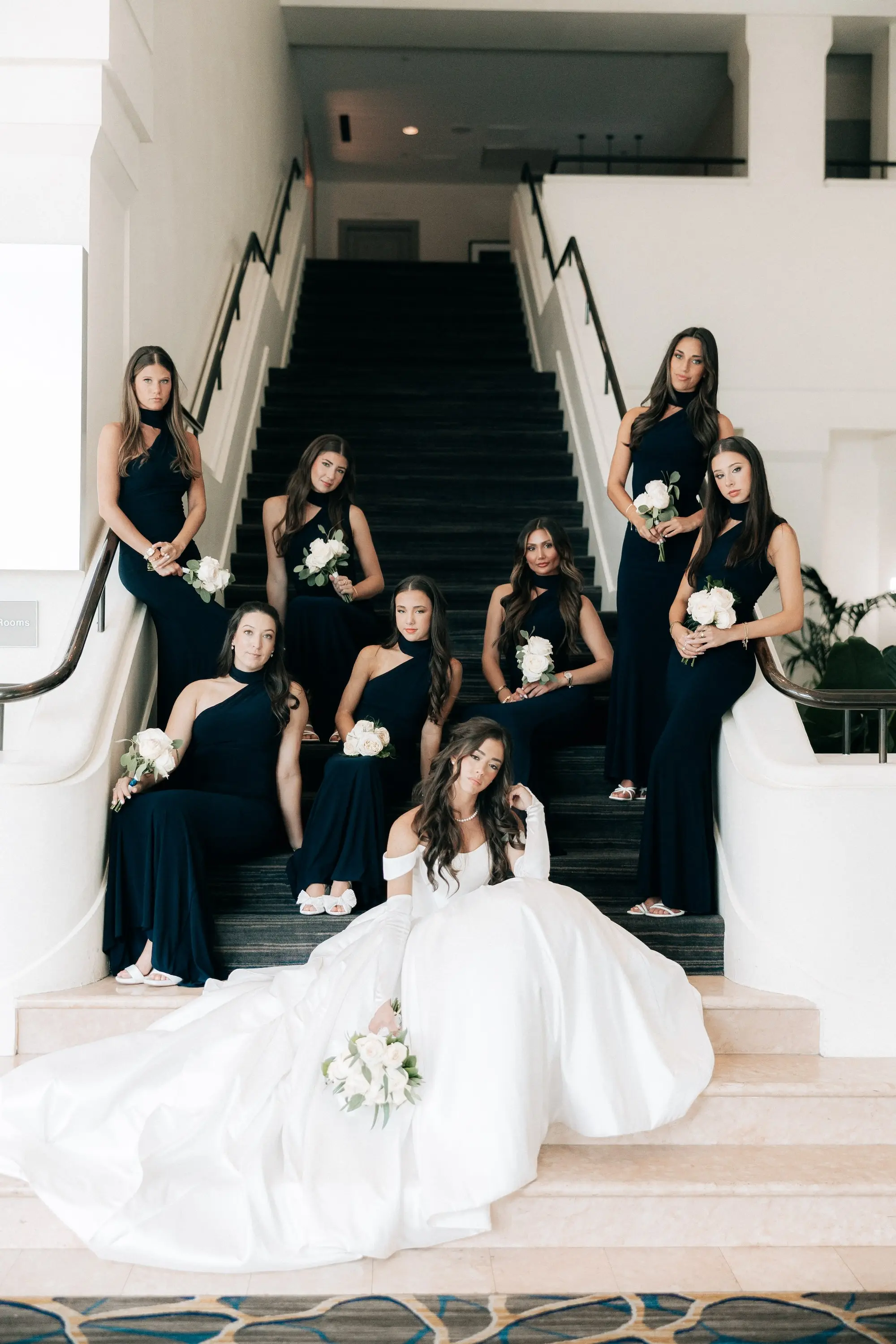 3Classic Gold and White Wedding Decor Inspiration - Classic, Ivory Rooftop Wedding | Grand Hyatt Tampa Bay Bride with Bridesmaids Wedding Portrait | Classic White Roses Bridal Bouquet Inspiration | One Shoulder Long Black Bridesmaid Dresses Ideas