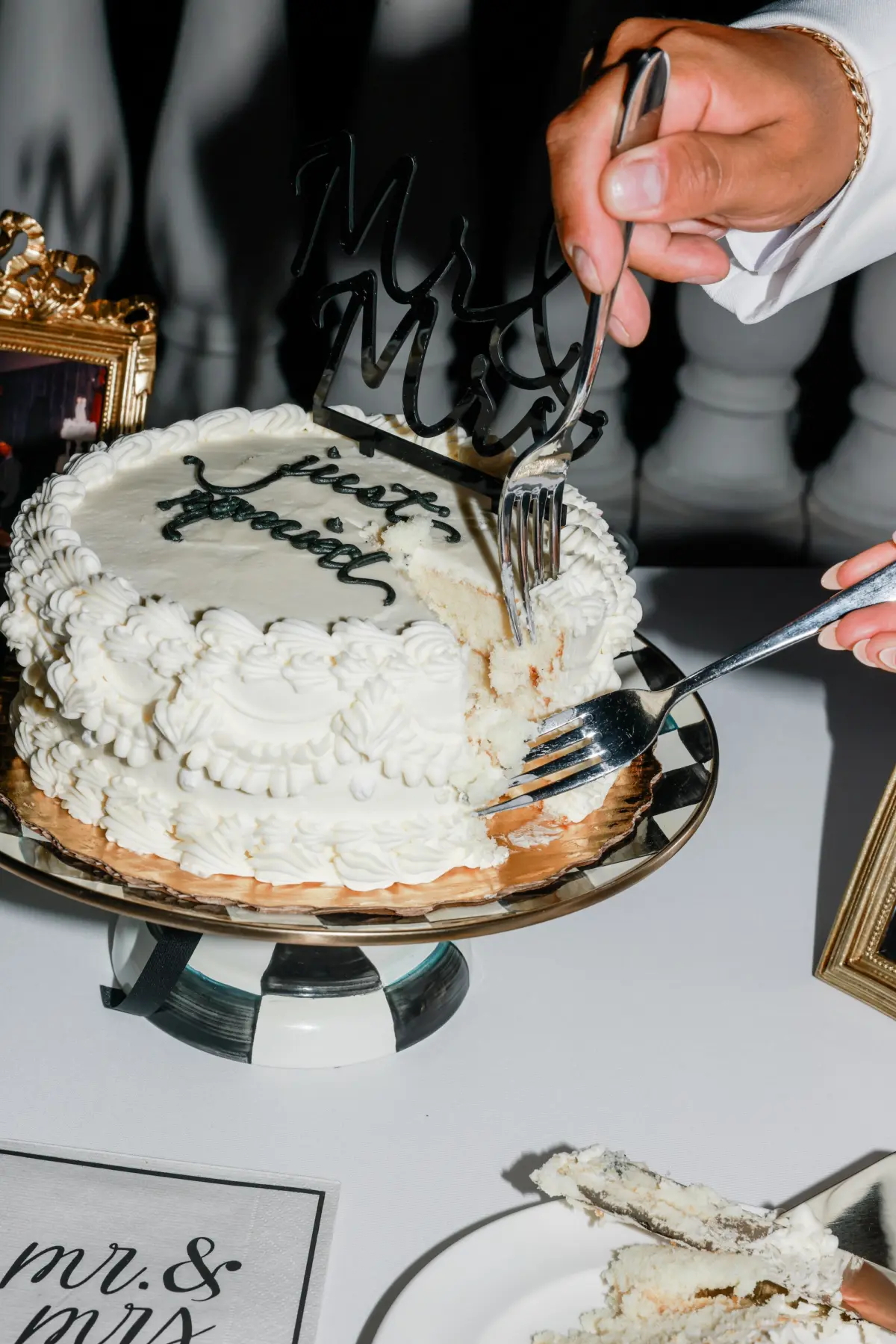 Single Layer Round White Wedding Reception Cake with Black Writing Inspiration | Mackenzie Childs Black and White Checkered Cake Stand Ideas