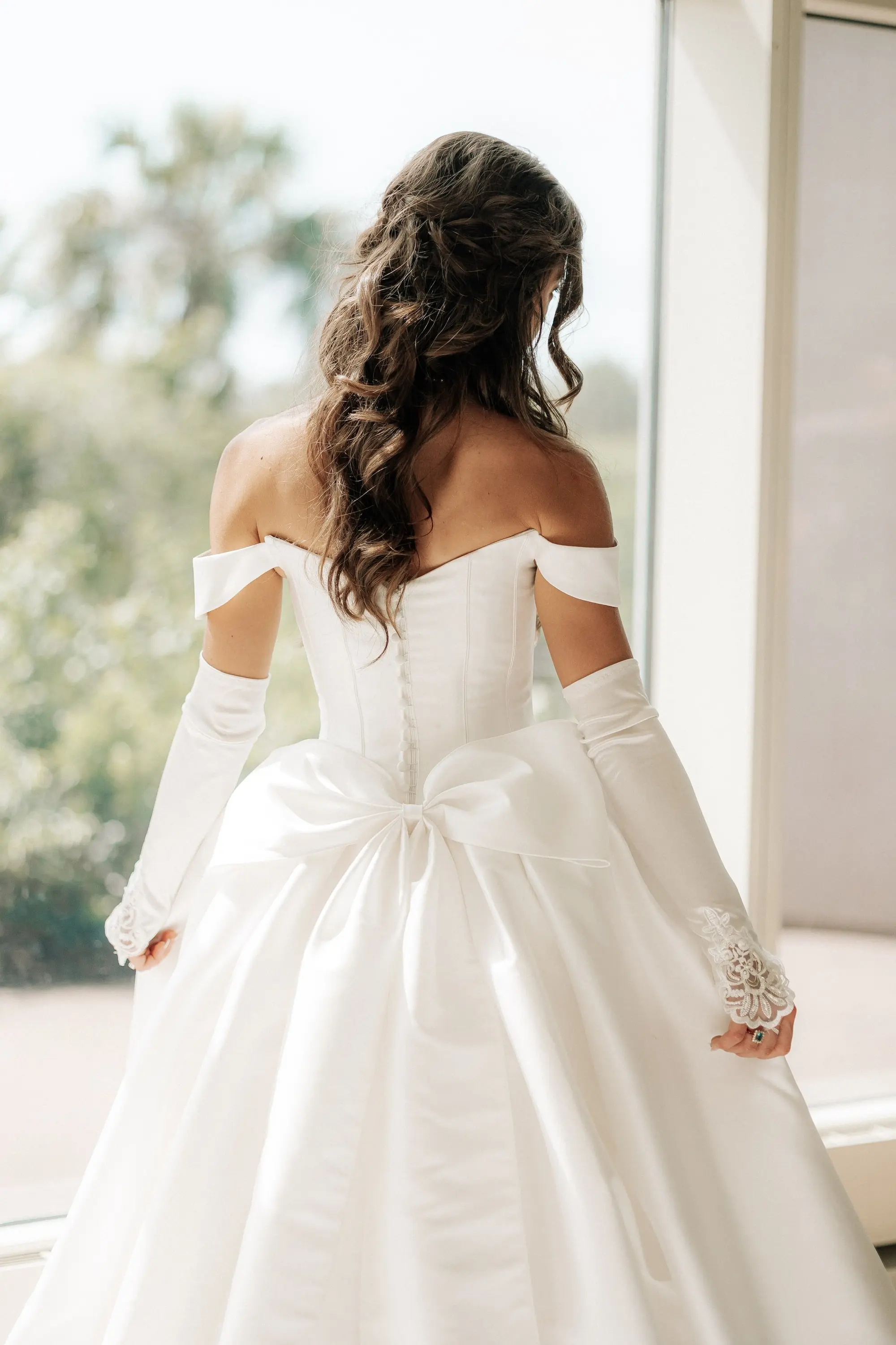 5Classic Gold and White Wedding Decor Inspiration - Classic, Ivory Rooftop Wedding | Grand Hyatt Tampa Bay Bride Wedding Portrait | White Off-the-Shoulder Ballgown Essense of Australia Wedding Gown with Buttons Down a Fitted Bodices and Detailed Lace White Gloves Inspiration