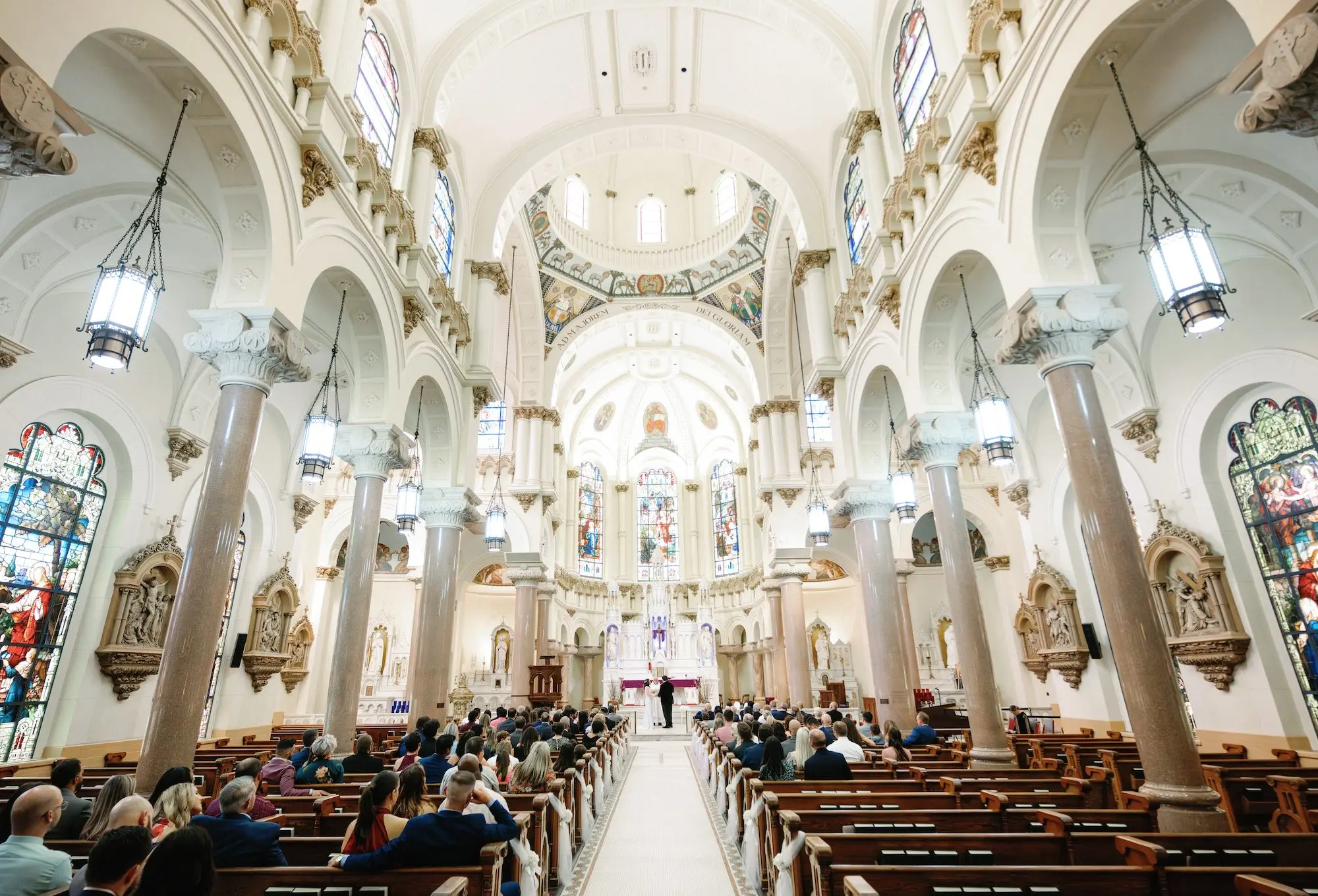 10Whimsical Rainbow Inspired Wedding Ideas Tampa Sacred Heart Catholic Church - Whimsical, Vibrant Downtown Tampa Wedding | Armature Works Bride and Groom Wedding Ceremony Vow Exchange Wedding Portrait | Downtown Tampa Sacred Heart Catholic Church | Photographer Dewitt For Love Photography