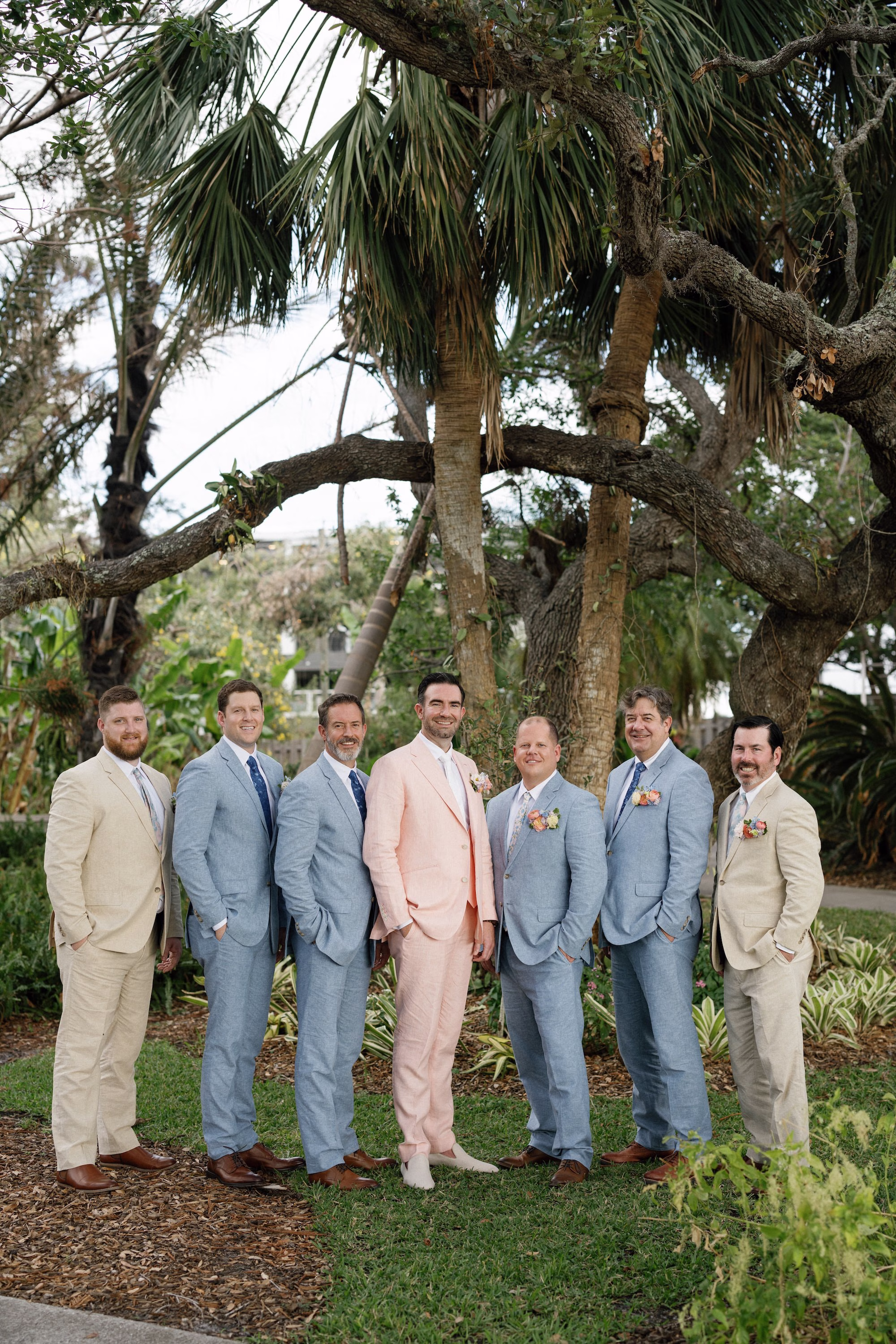 Groom and Groomsmen in Pink, Blue, and Khaki Suit Wedding Attire Ideas